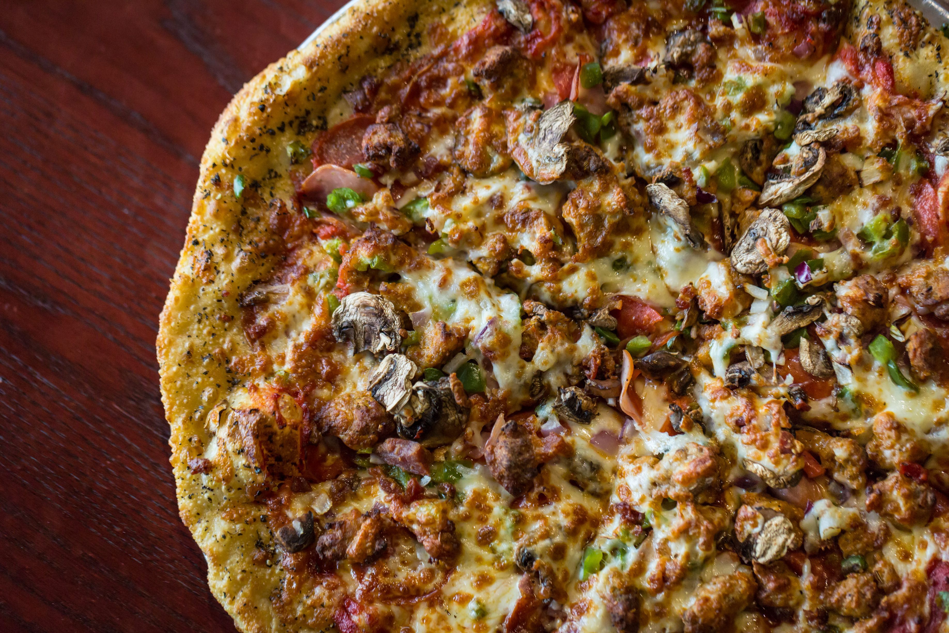 Order 2 Large 1 Topping Pizzas & 24 Wings food online from Duckworth's Grill & Taphouse Uptown store, Charlotte on bringmethat.com