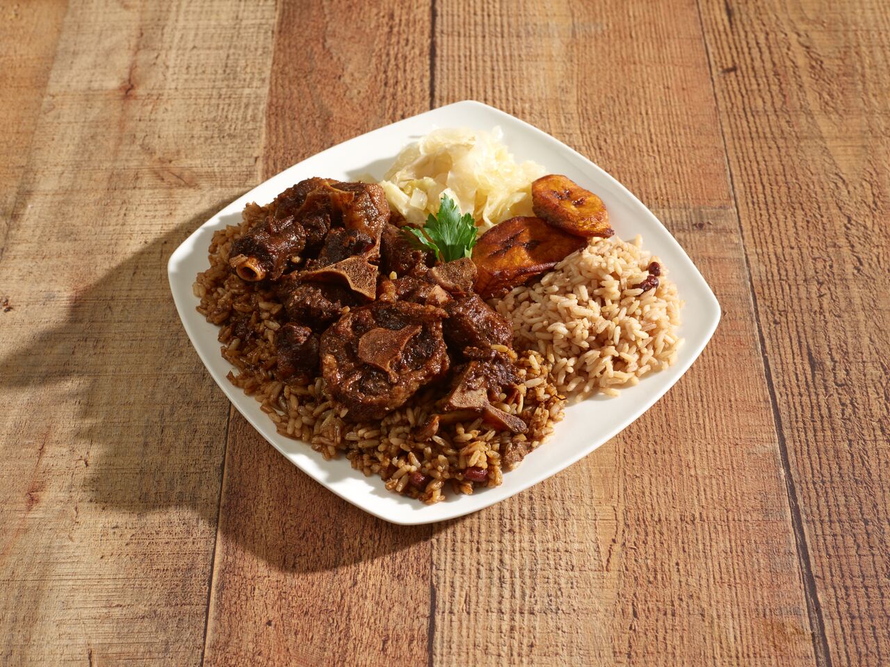 Order Oxtail food online from Caribbeans Delight store, Atlanta on bringmethat.com