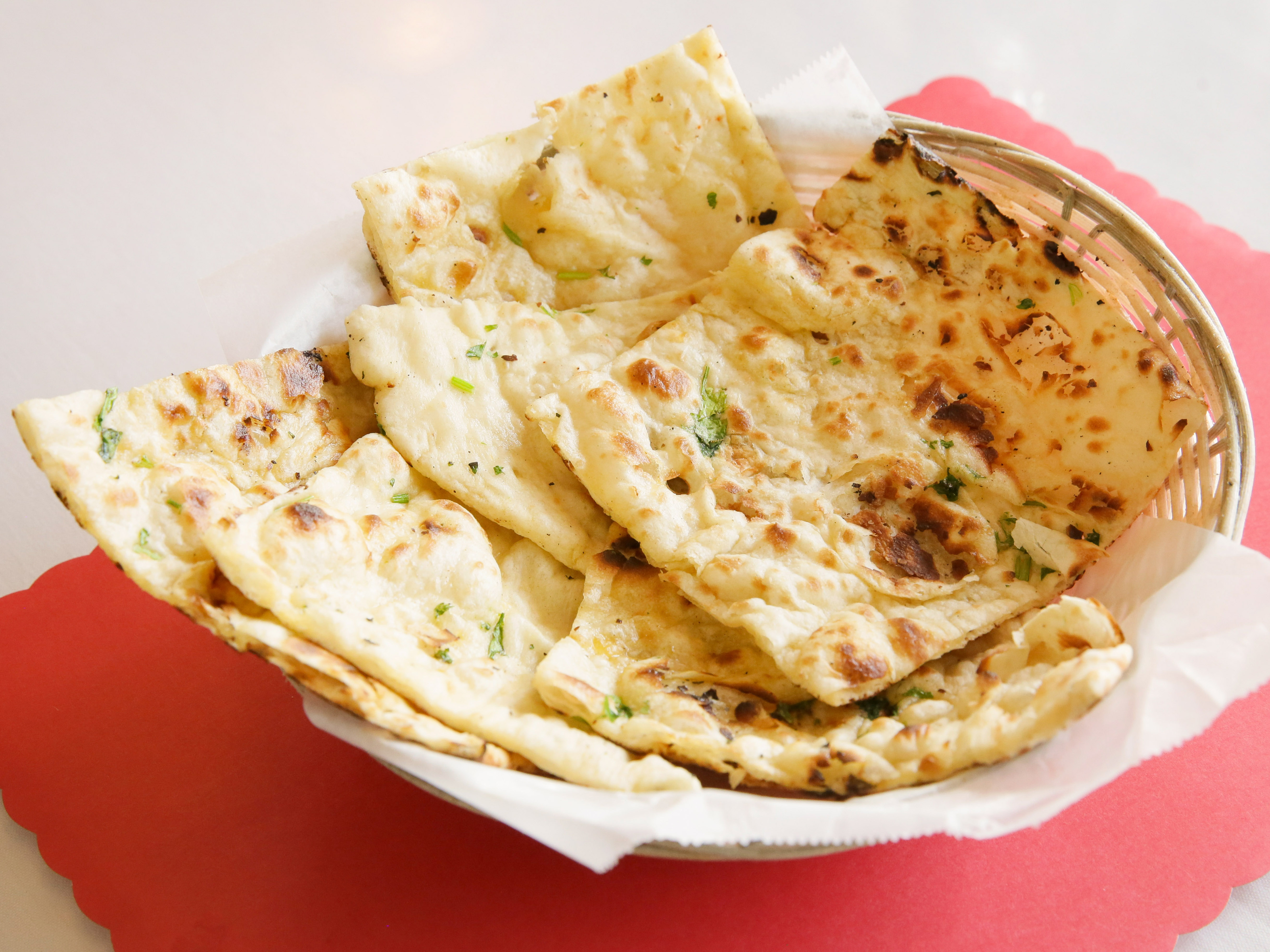 Order Garlic Naan food online from Royal India store, Milwaukee on bringmethat.com