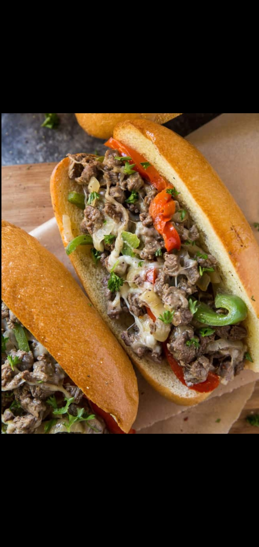 Order Philly Cheese Steak Sandwich (beef strips onions peppers & cheese) food online from American Gourmet Foods Deli store, New York on bringmethat.com