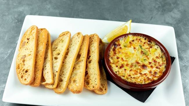 Order Famous Spicy Artichoke Dip food online from Patxi's Pizza store, Seattle on bringmethat.com