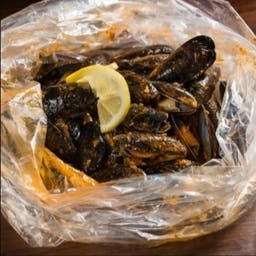 Order Lunch Special Black Mussels (1/2lb) food online from Ragin Cajun Crab store, Georgetown on bringmethat.com