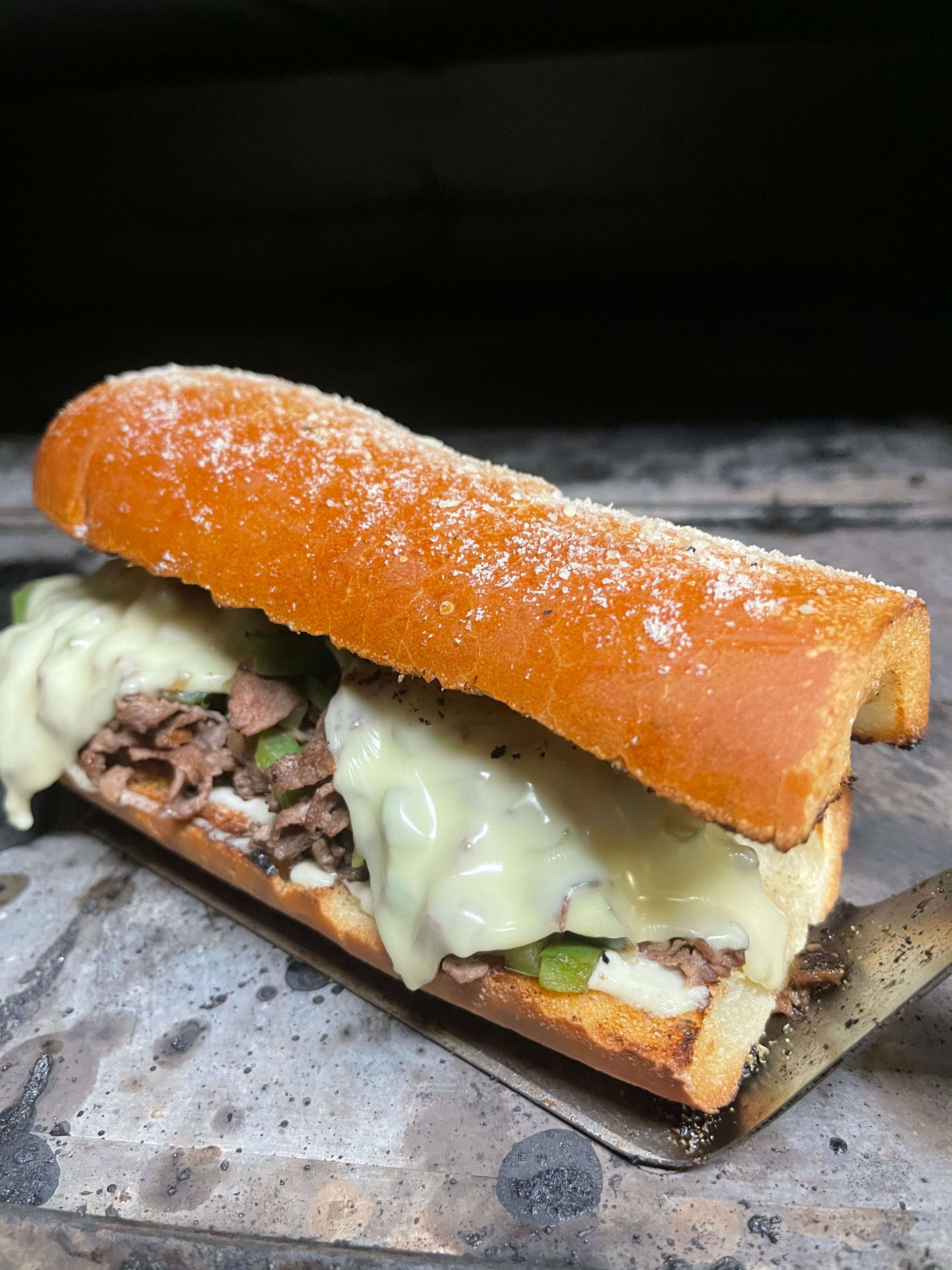 Order Philly Cheesesteak Sandwich - Sandwich food online from Johnny's Bar & Grill store, Sterling on bringmethat.com