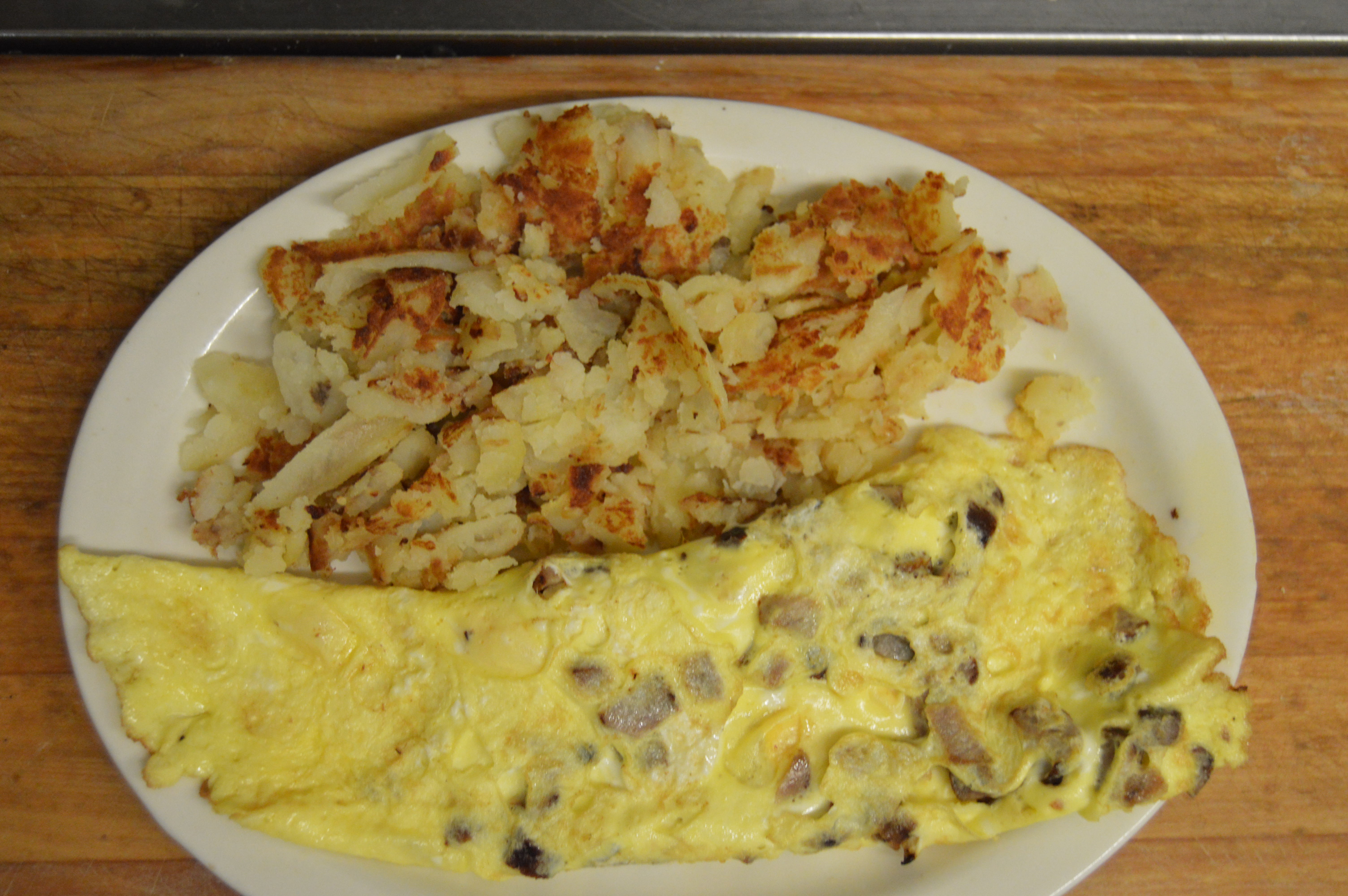 Order Sausage Omelette with Cheese food online from Angelas Family Restaurant store, Cleveland on bringmethat.com