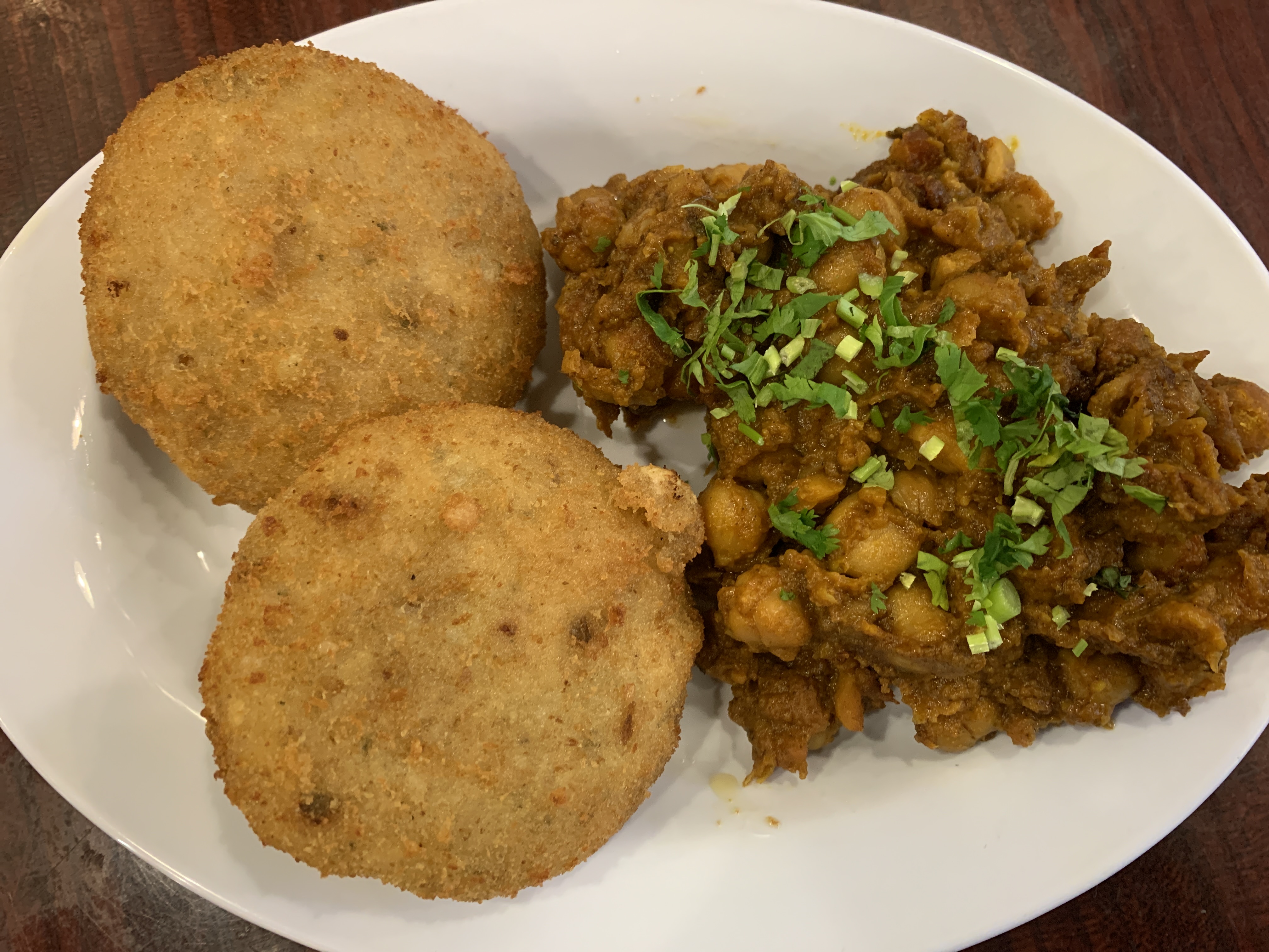 Order Aloo tikki Chole  food online from Bawarchi store, New York on bringmethat.com