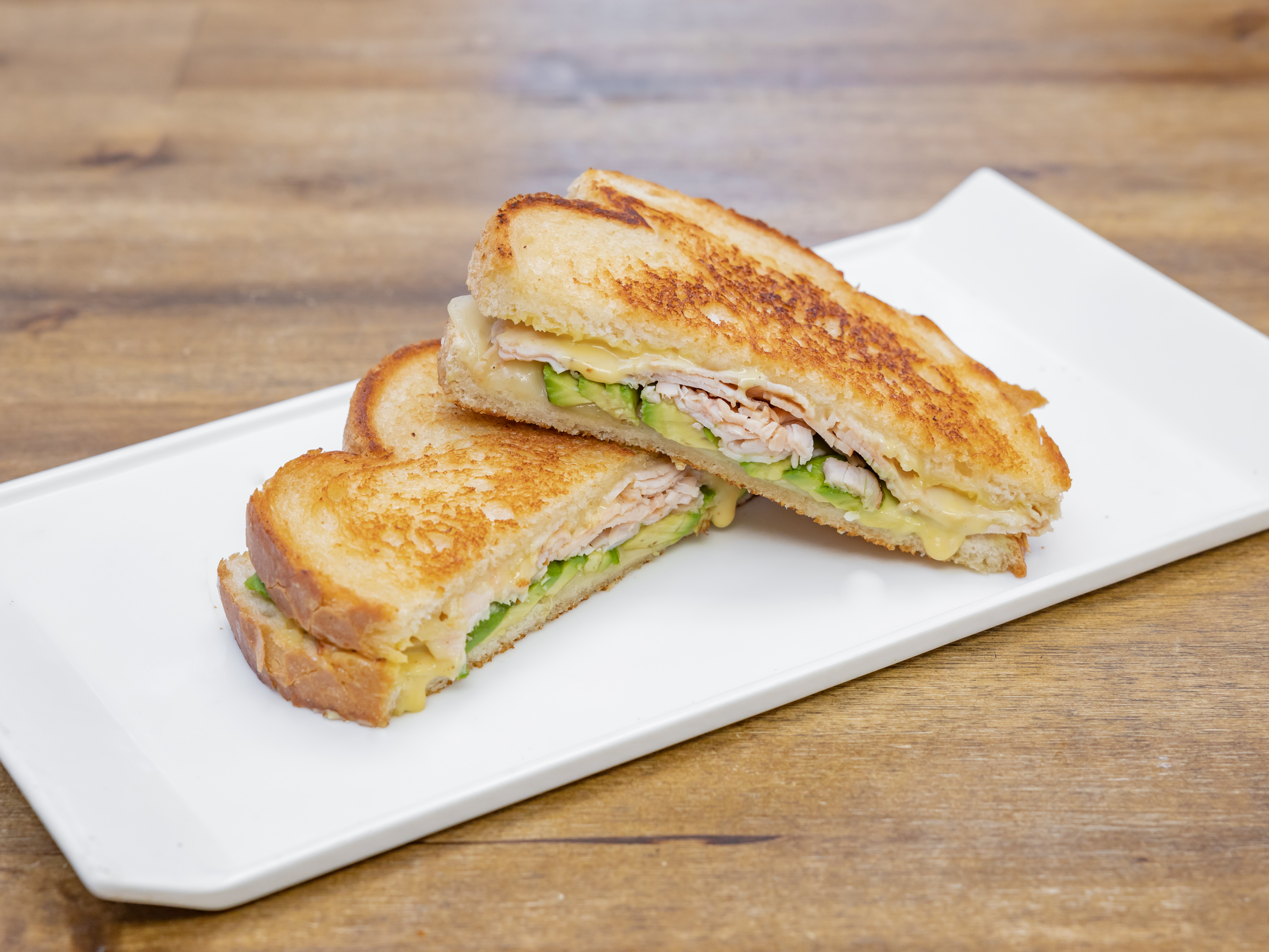Order Grilled Turkey Swiss Avocado food online from Cafe Miro store, Westminster on bringmethat.com