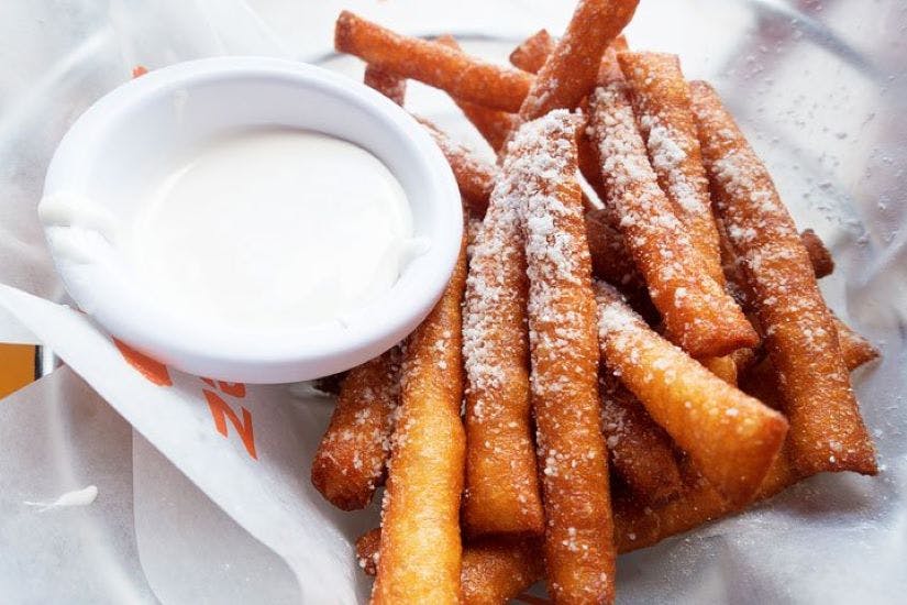 Order Funnel Cake Fries - Dessert food online from Tossed & Sauced store, Chesapeake on bringmethat.com