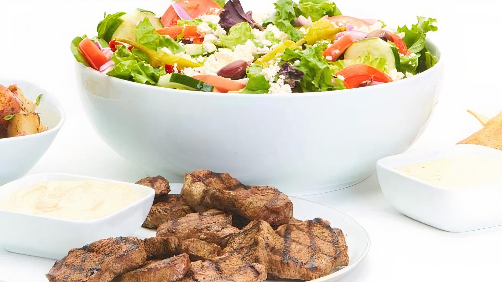 Order Grilled Beef Family Feast for 4 food online from Taziki's Mediterranean Cafe store, Brentwood on bringmethat.com