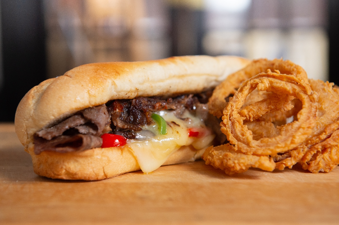 Order THE PHILLY CHEESESTEAK SANDWICH food online from Tycoon Flats store, San Antonio on bringmethat.com