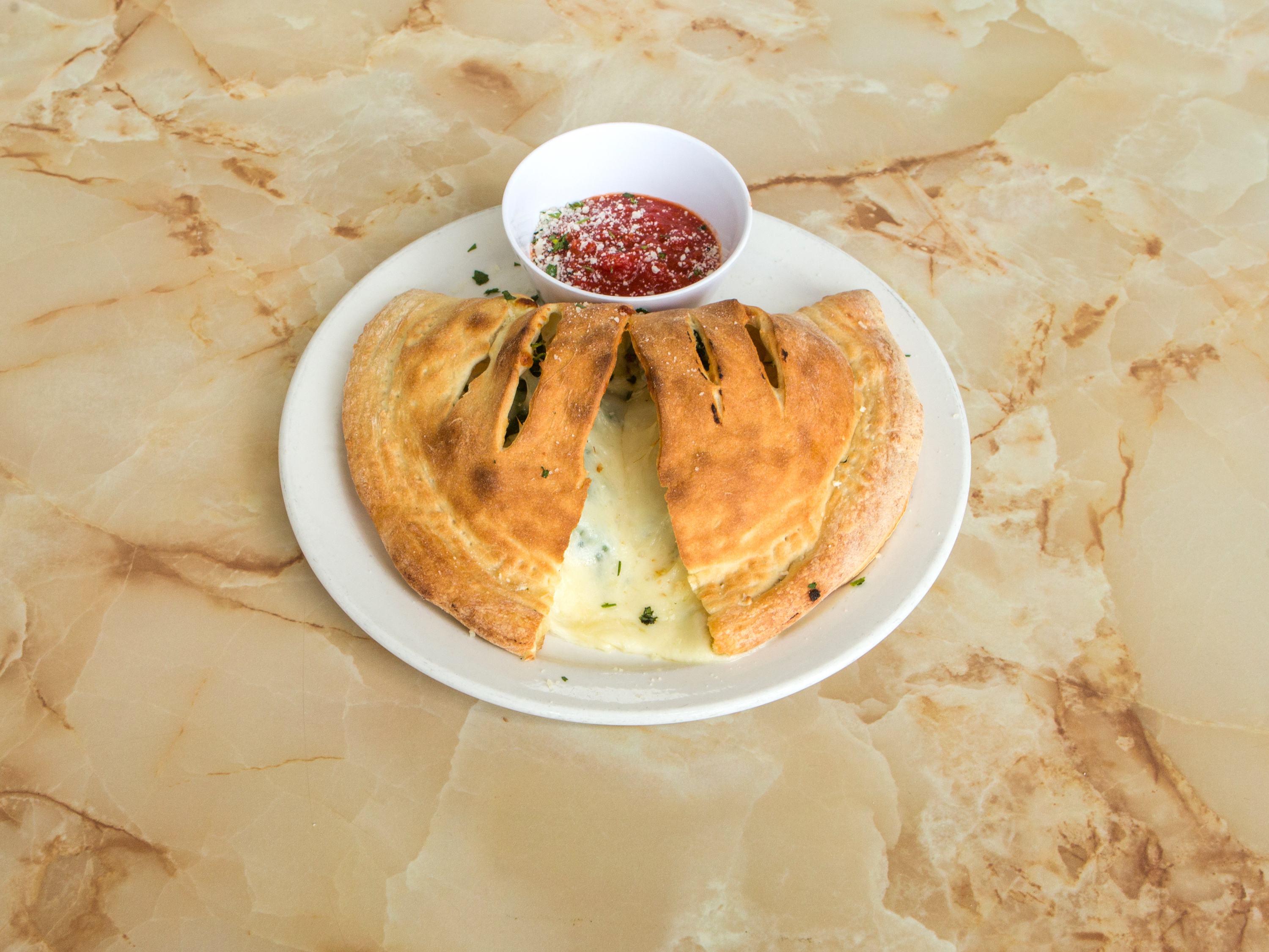 Order Spinach Calzone food online from Nucci Italian Cafe & Pizza store, Vista on bringmethat.com