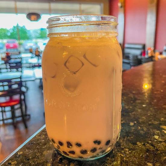 Order Taro Milk Tea (24 Oz) food online from Bibo's Cafe store, Harris County on bringmethat.com