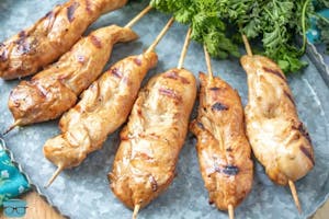 Order 9. Chicken on a Stick (4) 鸡肉串 food online from East Ocean store, Haymarket on bringmethat.com
