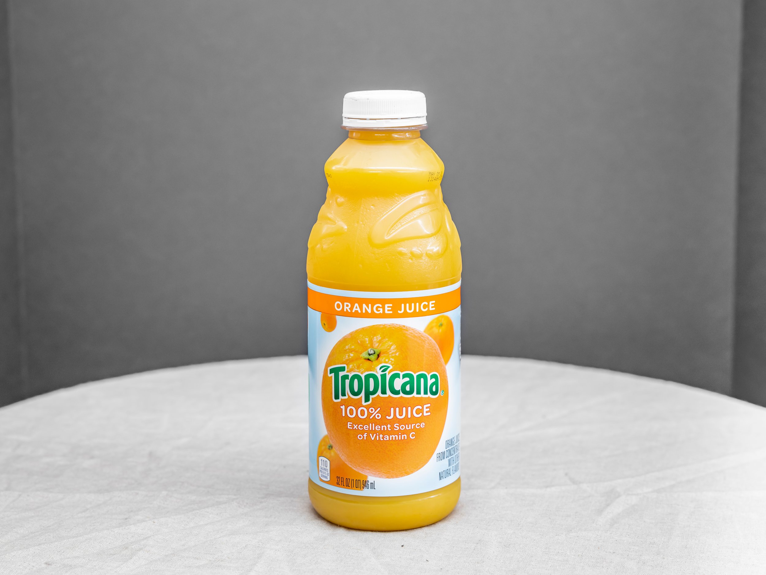 Order Tropicana Orange Juice 32 oz food online from Bistro Liquor store, Huntington Beach on bringmethat.com