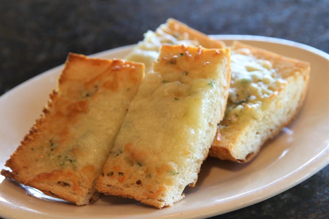 Order Cheesy Garlic Bread - Regular food online from Strizzi's store, Pleasanton on bringmethat.com