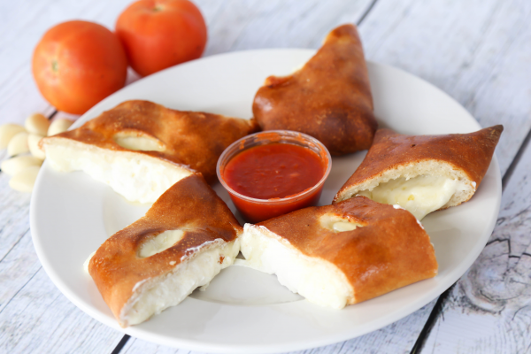 Order Calzone food online from Vito's Gourmet Pizza store, Pompano Beach on bringmethat.com