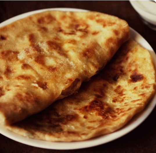 Order 6. Aloo Kulcha food online from The Little India Restaurant store, Indianapolis on bringmethat.com