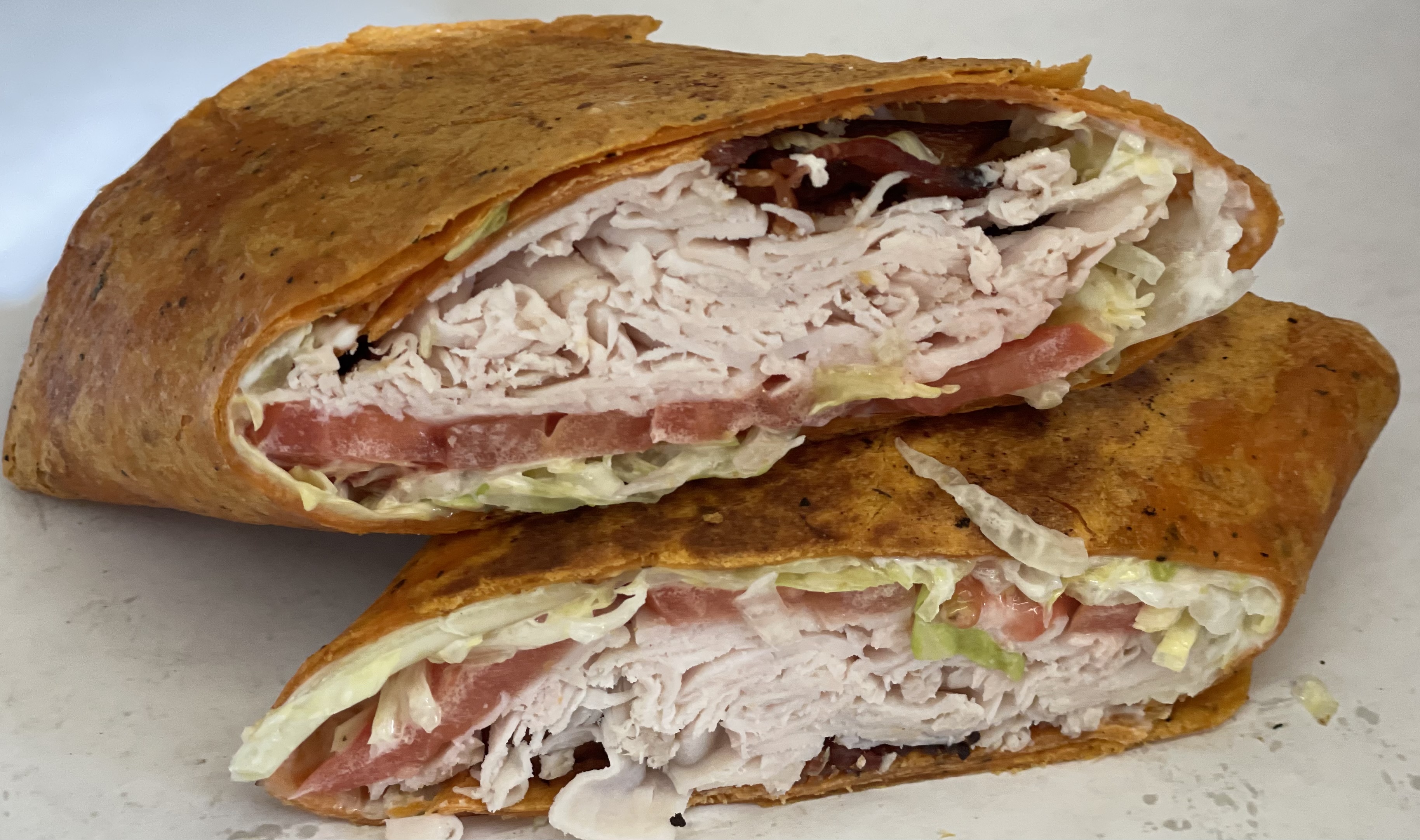 Order Turkey Club Wrap food online from Anthony Deli store, White Plains on bringmethat.com