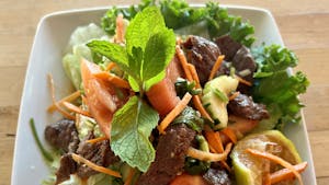 Order Spicy Grilled Beef Salad food online from Asian thai 2 go store, Dallas on bringmethat.com