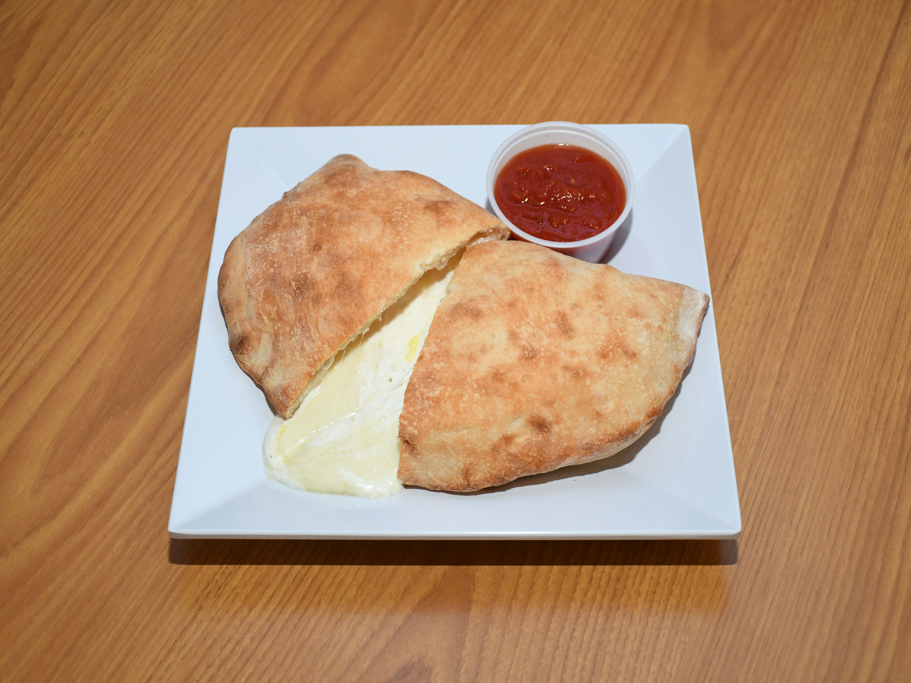Order Cheese Calzone food online from Taste Of New York Pizza store, West Des Moines on bringmethat.com