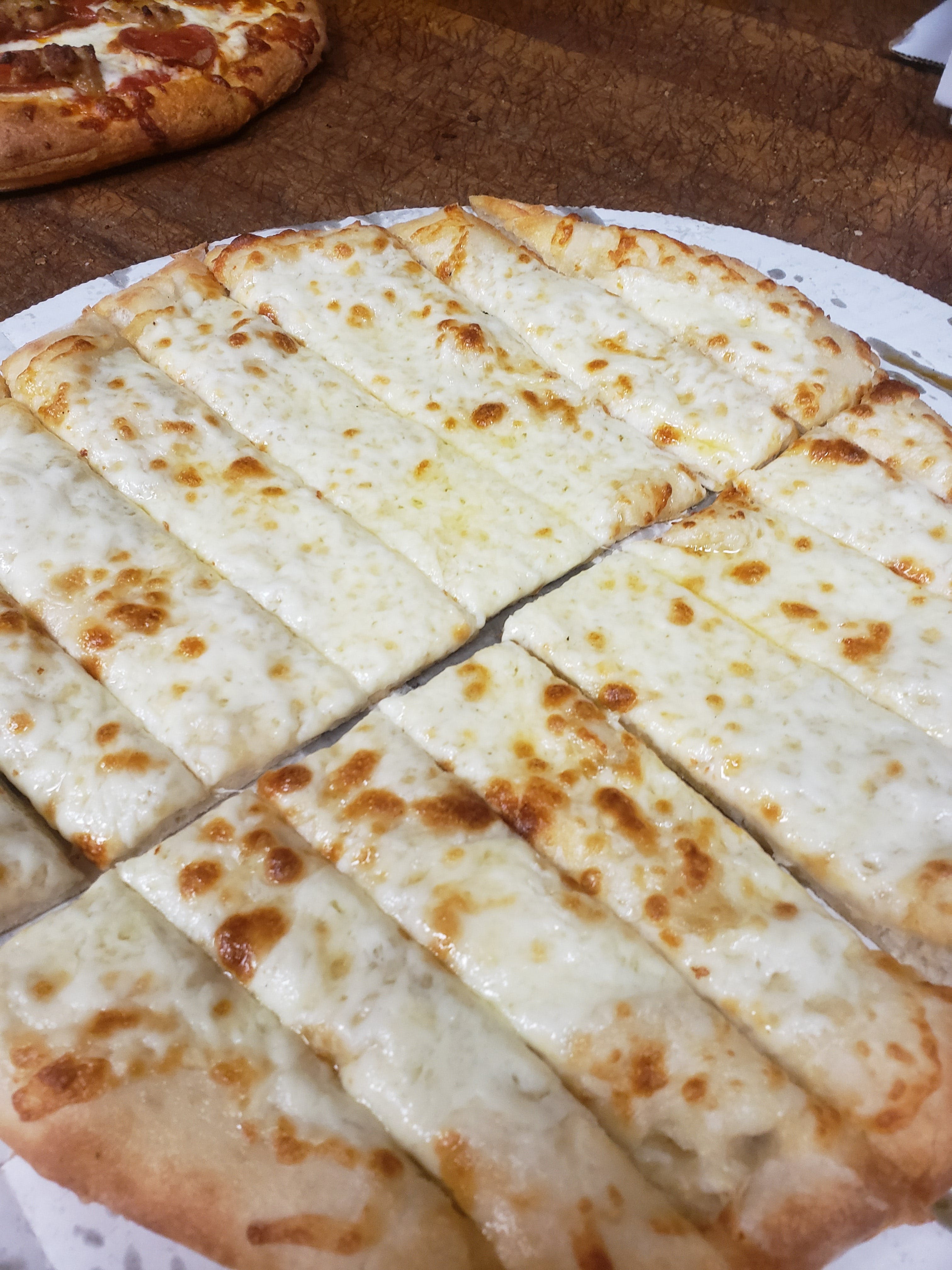 Order Cheesy Breadsticks - Appetizer food online from Red Devil Pizza store, Covina on bringmethat.com