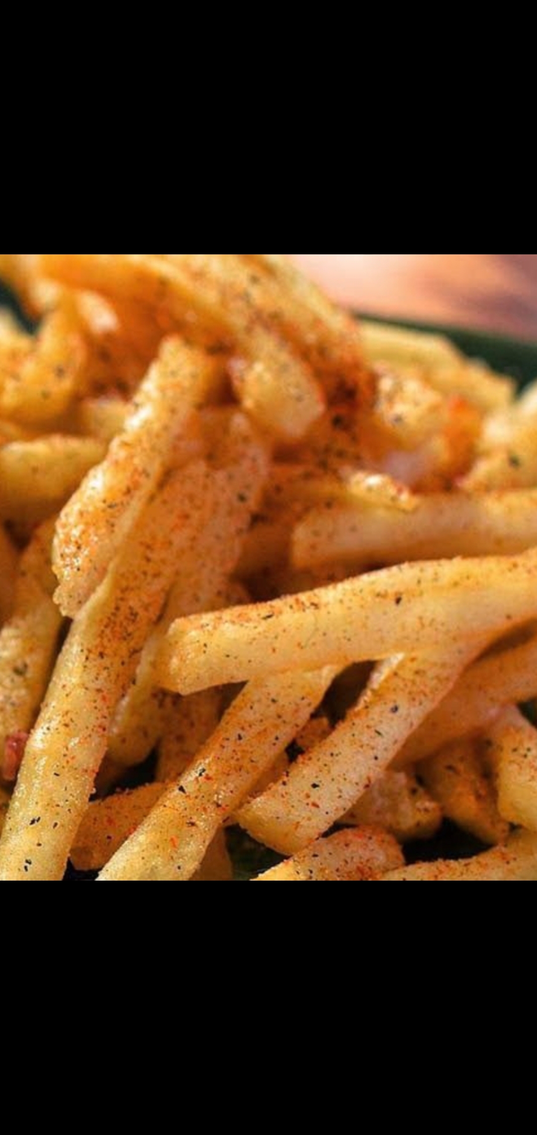 Order Spicy Cajun French Fries food online from American Gourmet Foods Deli store, New York on bringmethat.com