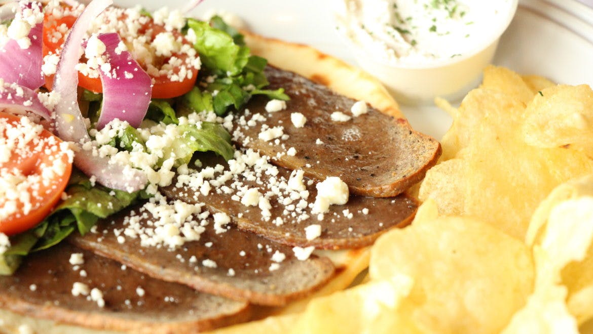 Order Greek Gyro Sandwich - Sandwich food online from Palios Pizza Cafe store, Colleyville on bringmethat.com