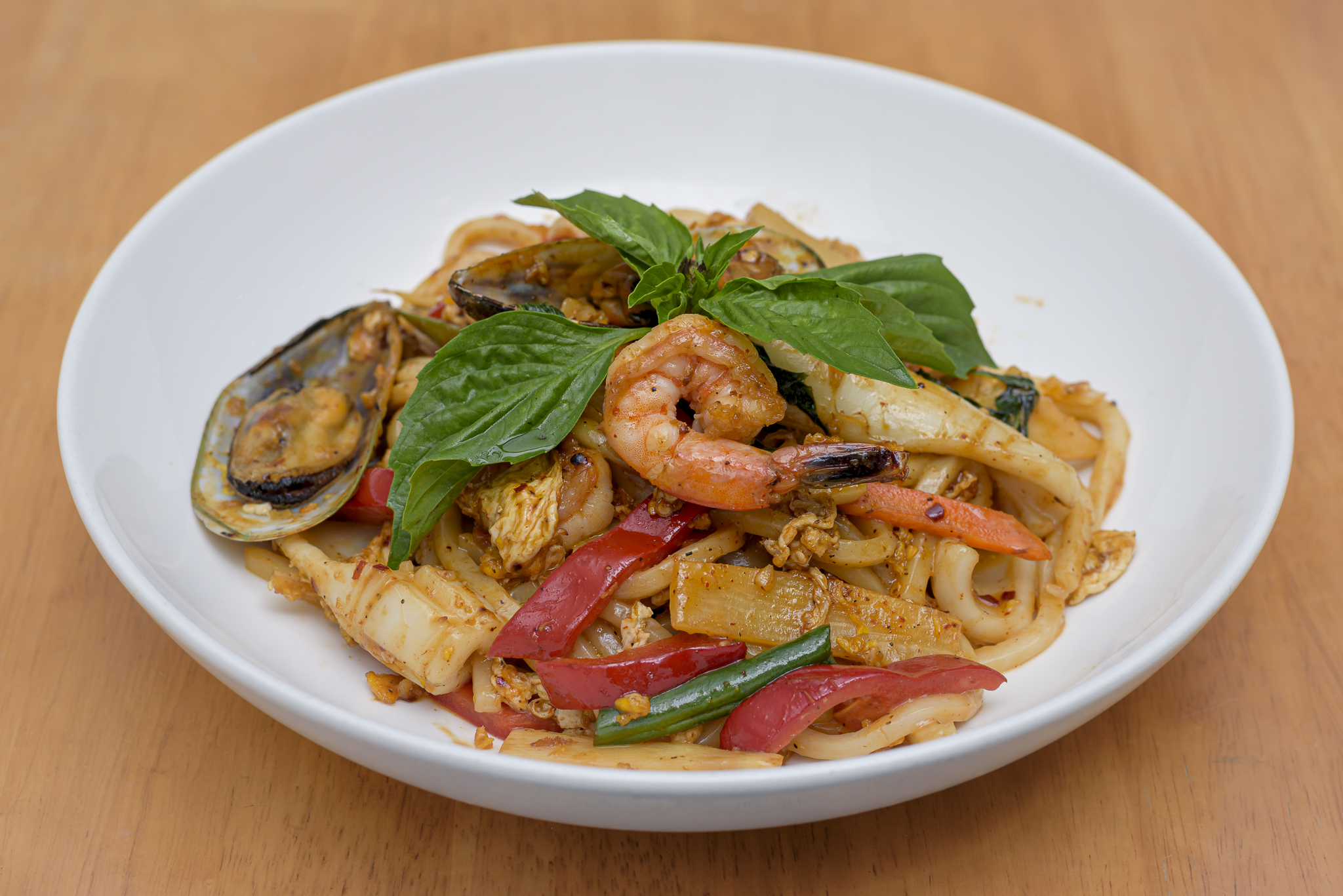 Order Seafood Basil Udon Noodle food online from Tue thai store, New York on bringmethat.com