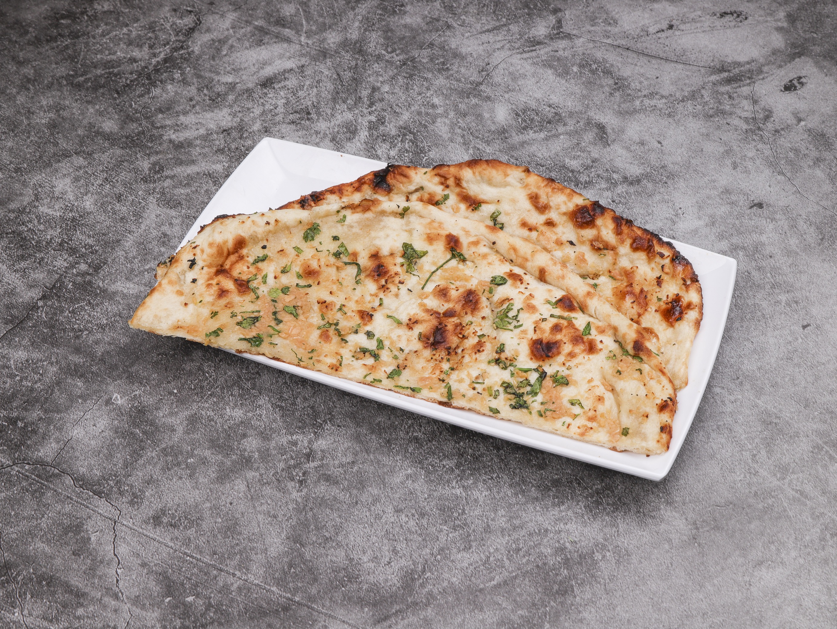 Order Garlic Naan food online from Haveli Indian Grill & Cuisine store, West Chester on bringmethat.com