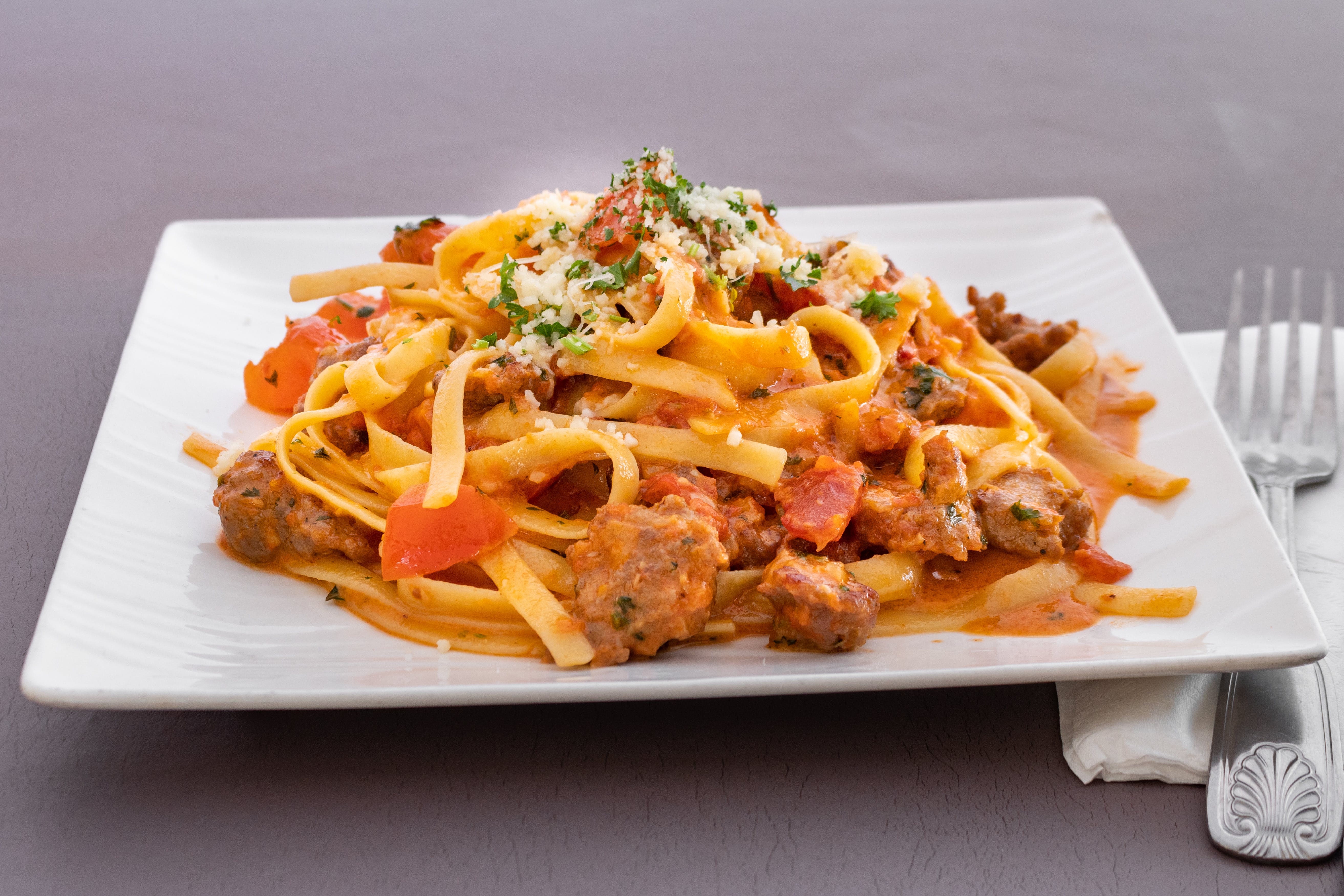 Order Fettuccine with Sausage - Pasta food online from Johnnie's NY Pizza store, Venice on bringmethat.com
