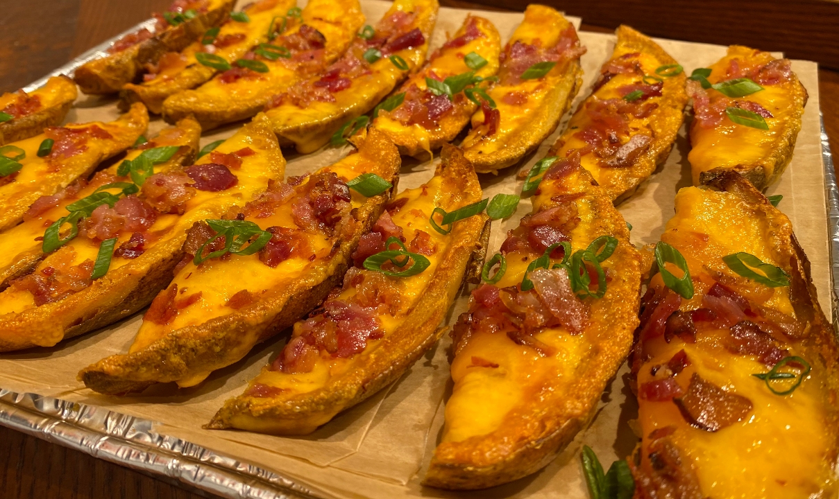 Order Loaded Potato Skins Tray food online from Marshall Hall Of Fame Cafe store, Huntington on bringmethat.com
