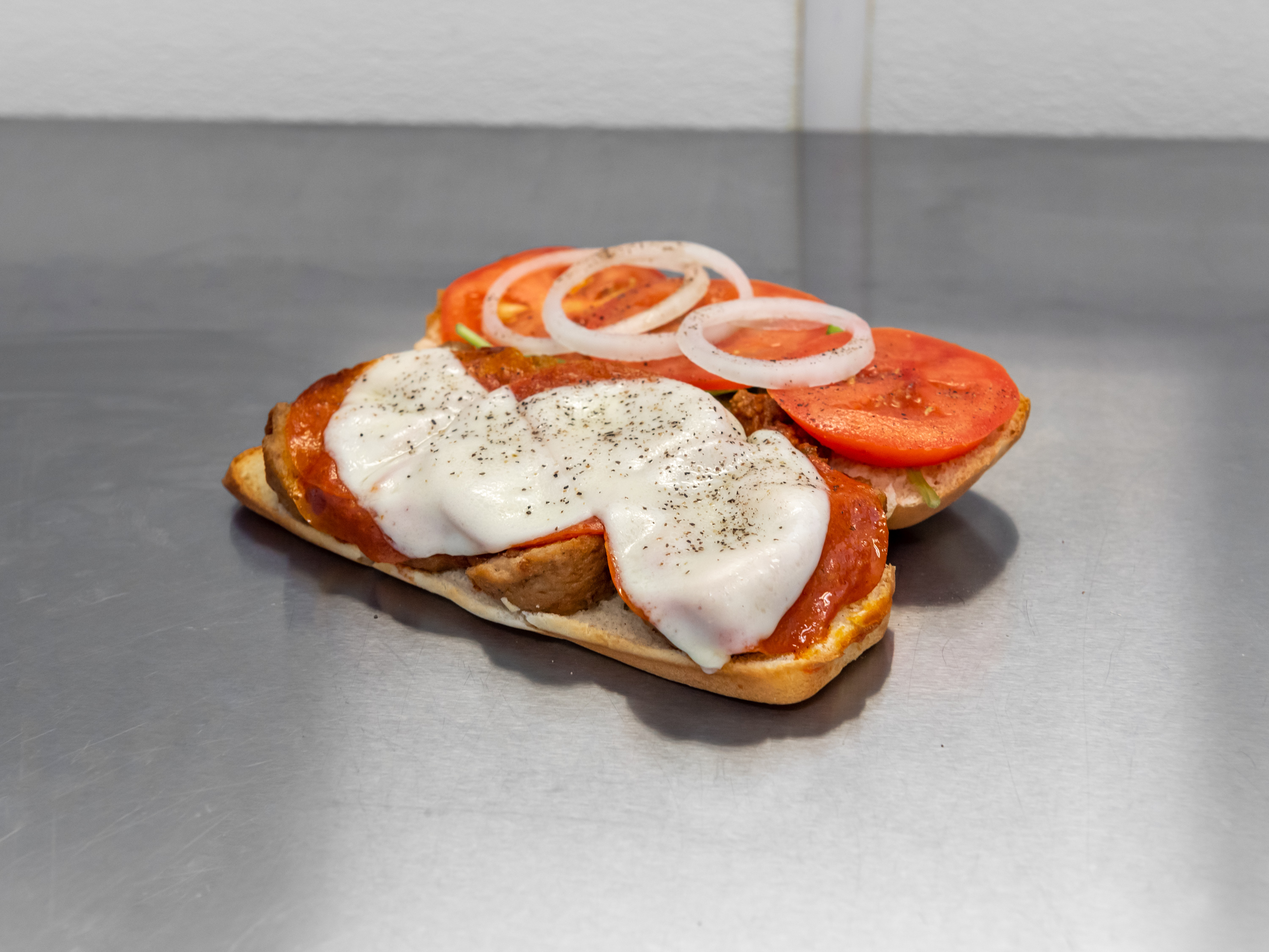 Order 7. Pizza Sub food online from Sandwich Man store, Whitehall on bringmethat.com