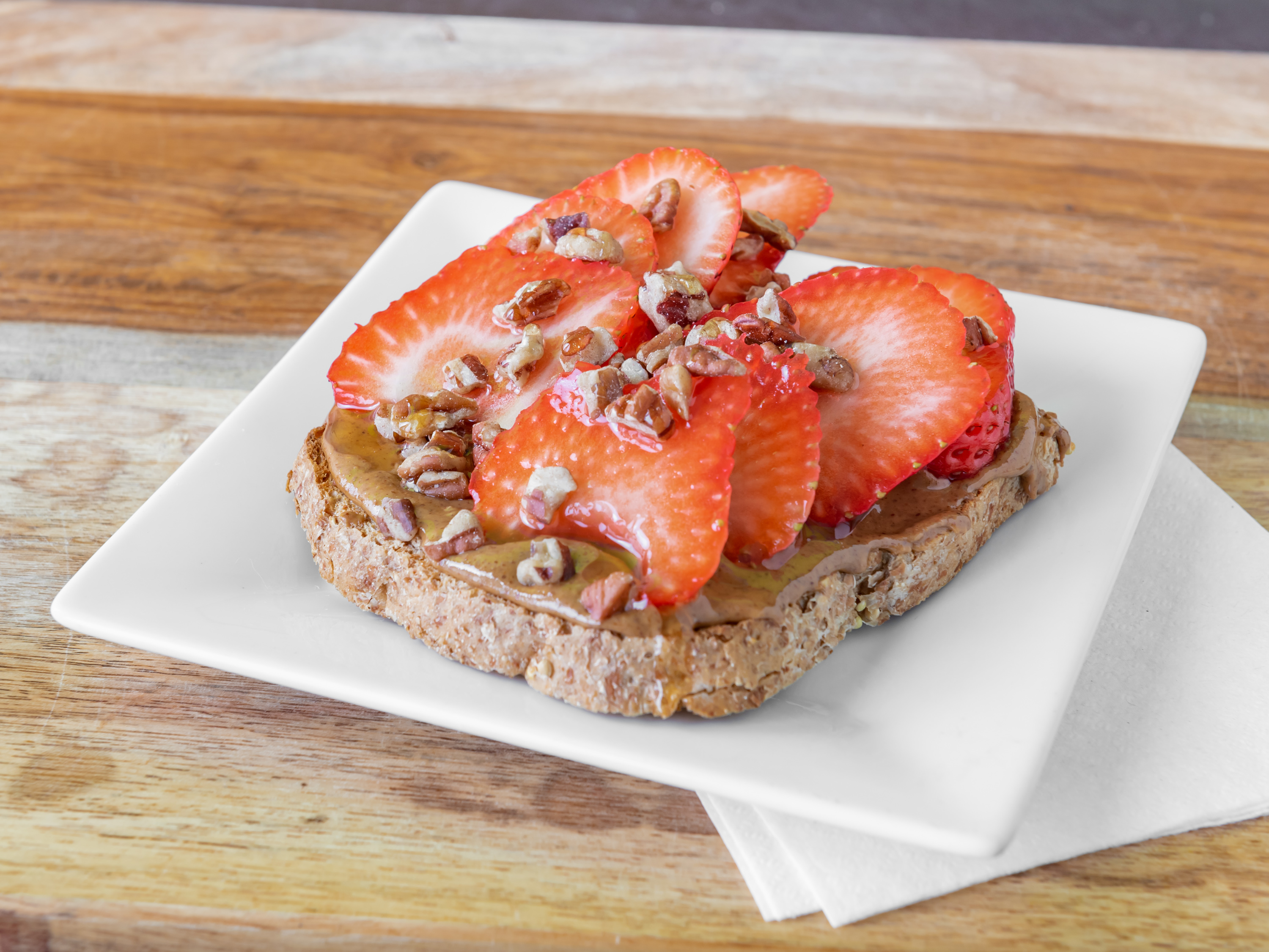 Order Almond Strawberry Toast food online from Dulce Vida Juice Bar store, Hanover Park on bringmethat.com