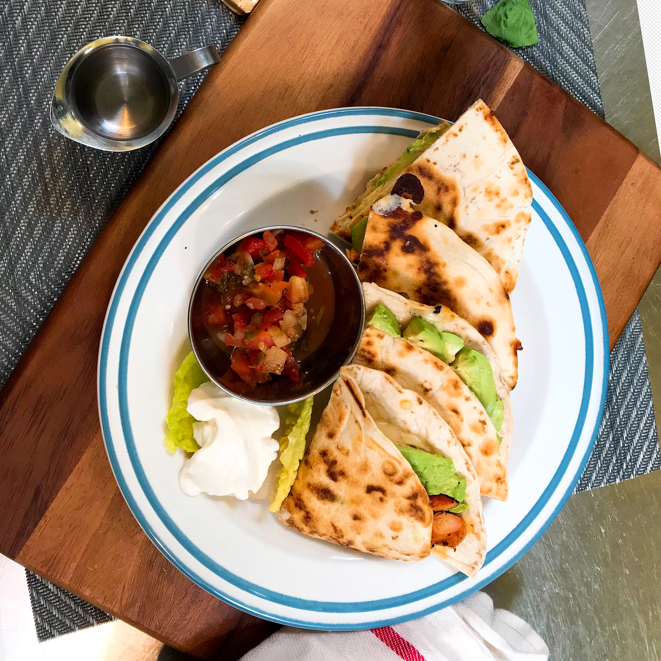 Order Grilled chicken Breast, Avocado and Cheddar Cheese Quesadilla food online from Lynn & Lu's Escapade Cafe store, Oakland on bringmethat.com