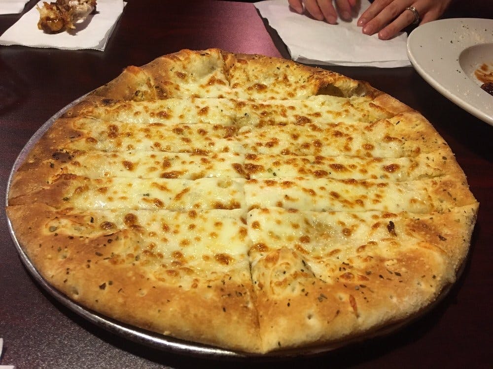 Order Plain Cheesy Breadsticks - 10 Pieces food online from CAP's Pizza & Tap House store, Sacramento on bringmethat.com