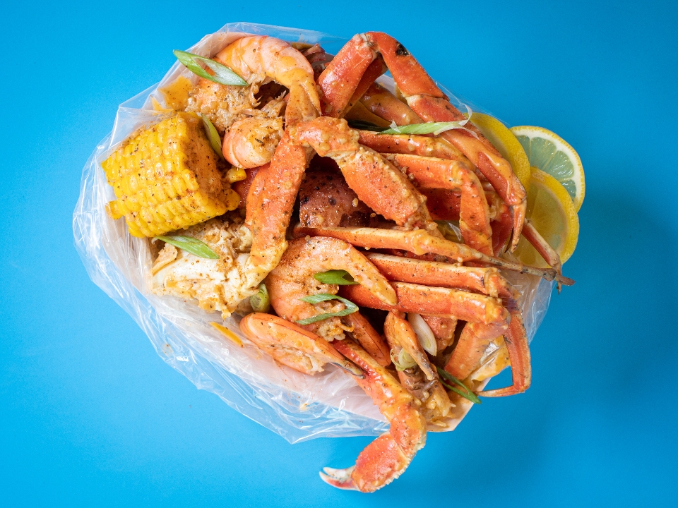 Order CRAB LEGS W/ SHRIMP STEAMPOT $46.74 food online from LoLo's Seafood Shack store, New York on bringmethat.com
