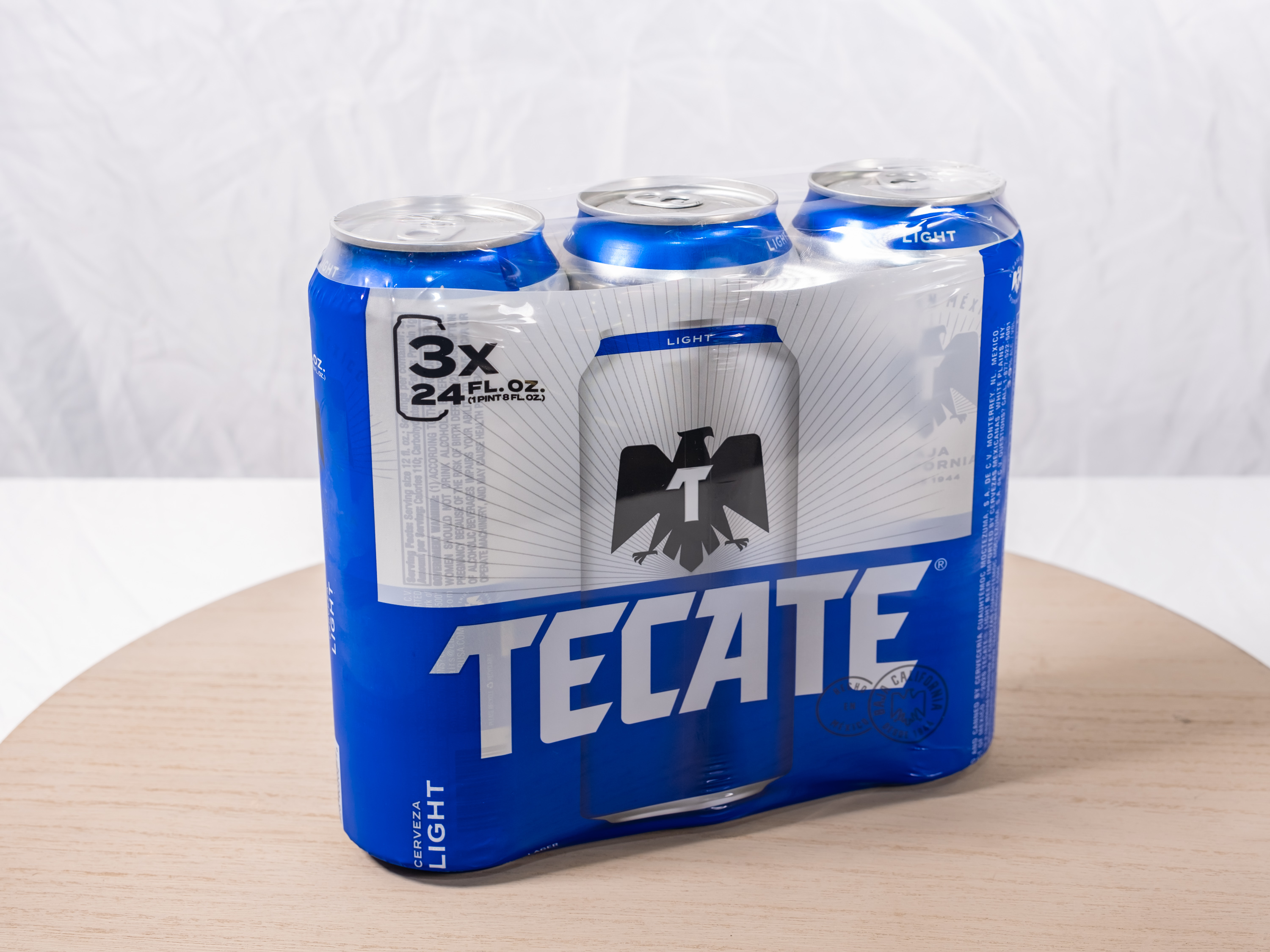 Order 3 Pack of Tecate Light food online from M & G Market store, Highland on bringmethat.com