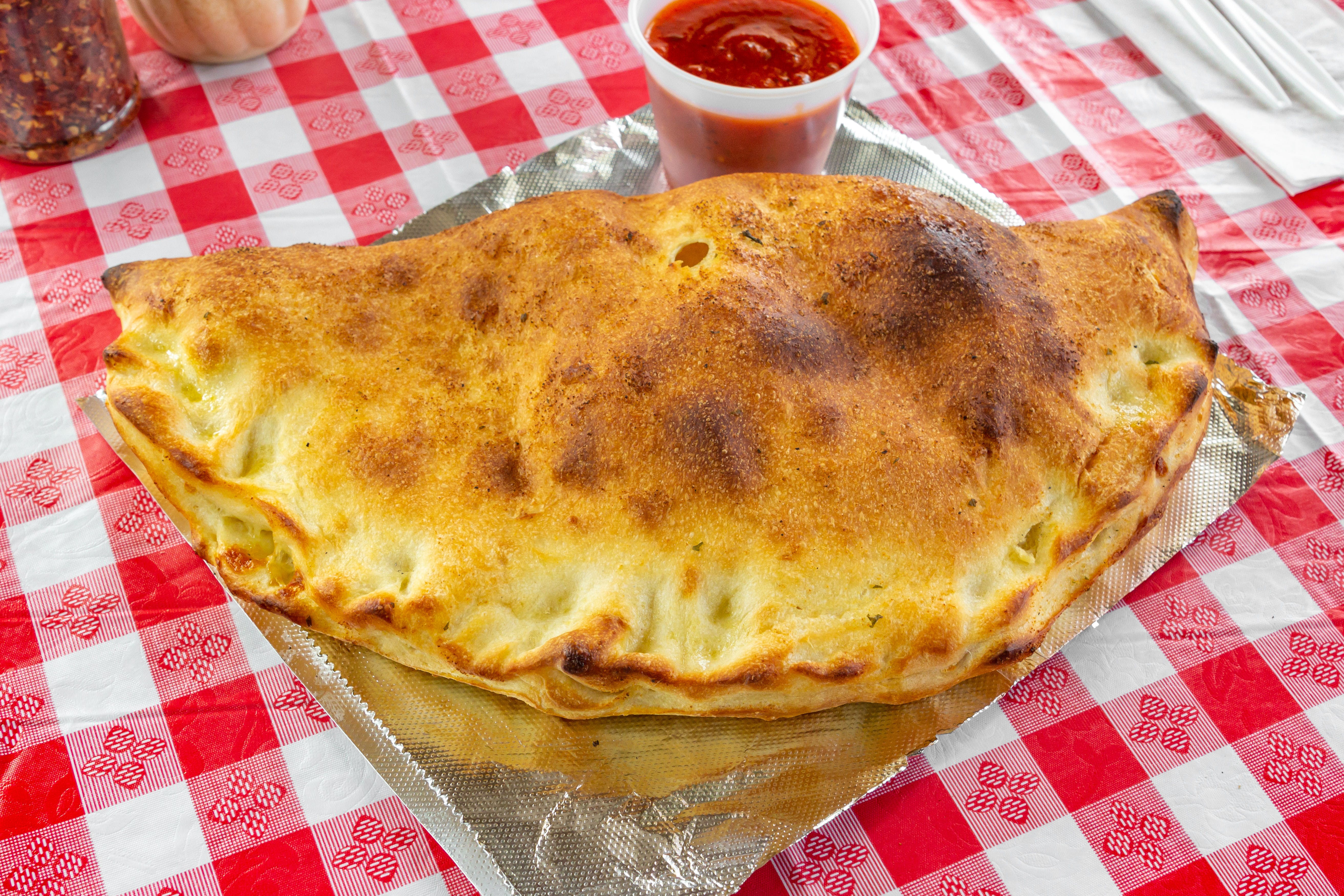 Order Calzone - Large food online from Pizza Central store, Colonie on bringmethat.com