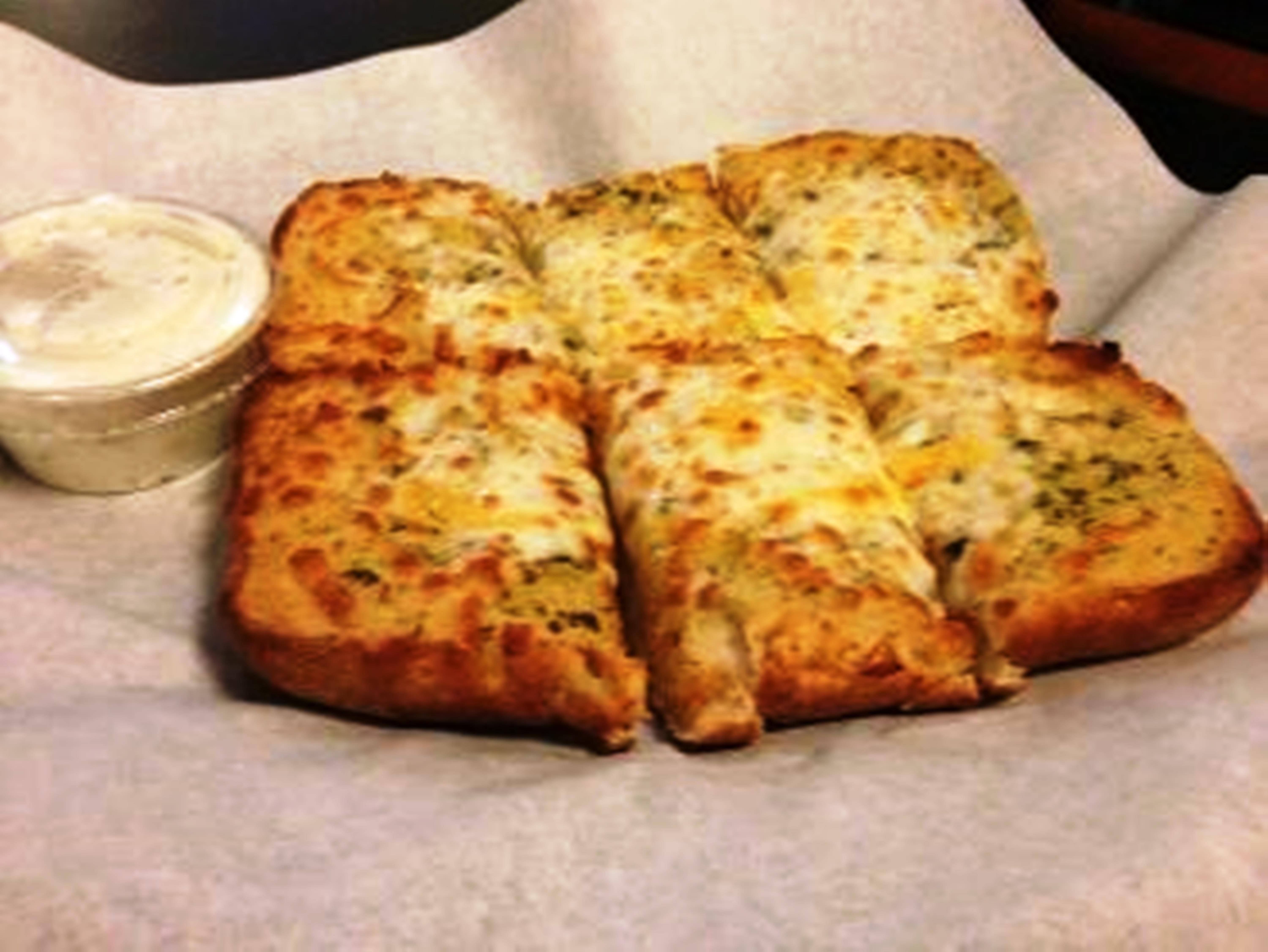 Order Garlic Bread with Cheese food online from Round Table Pizza store, Millbrae on bringmethat.com