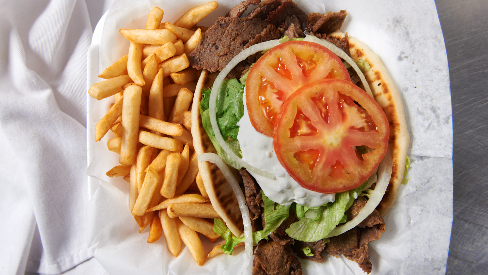 Order Gyro on Pita Sandwich food online from Chillie's Deli store, Cleveland on bringmethat.com