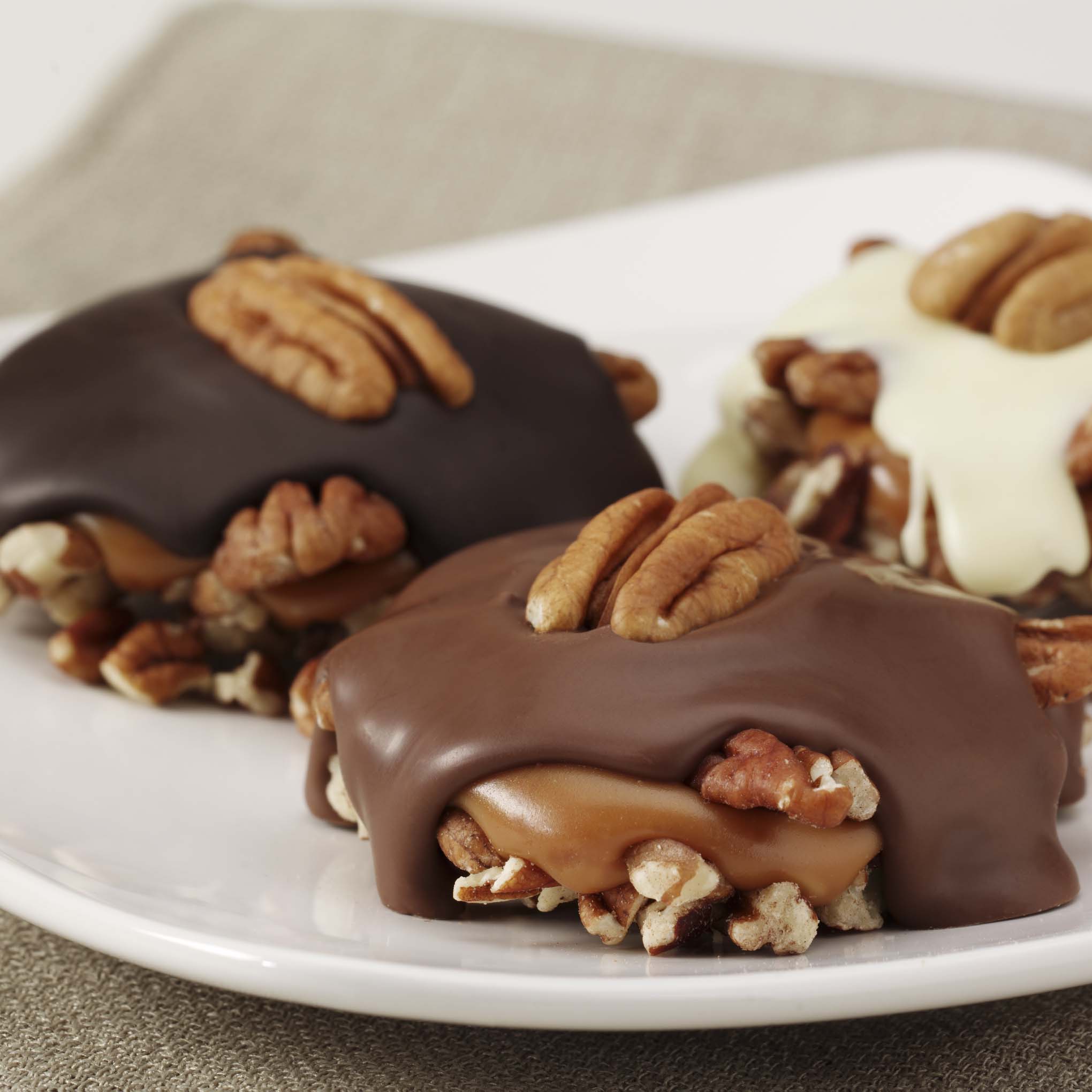 Order Pecan Delights food online from Russell Stover Chocolates store, Omaha on bringmethat.com