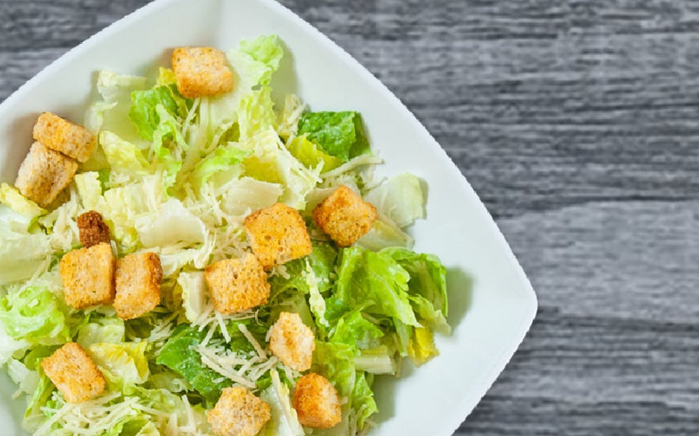 Order Caesar Salad - Regular food online from Seasons Pizza store, Wayne on bringmethat.com