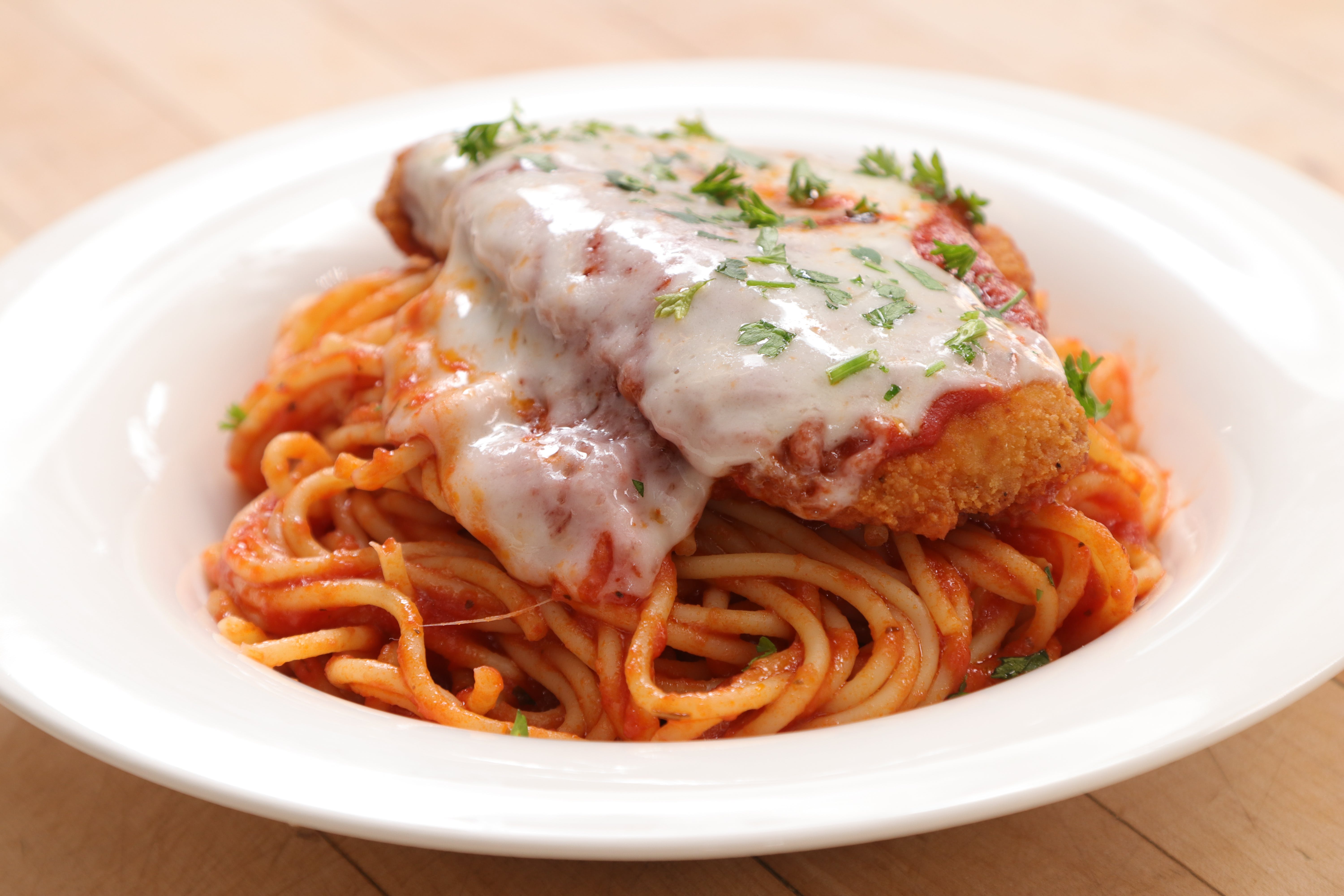 Order Chicken Parmigiana Pasta - Pasta food online from Ameci Pizza & Pasta store, Canyon Country on bringmethat.com