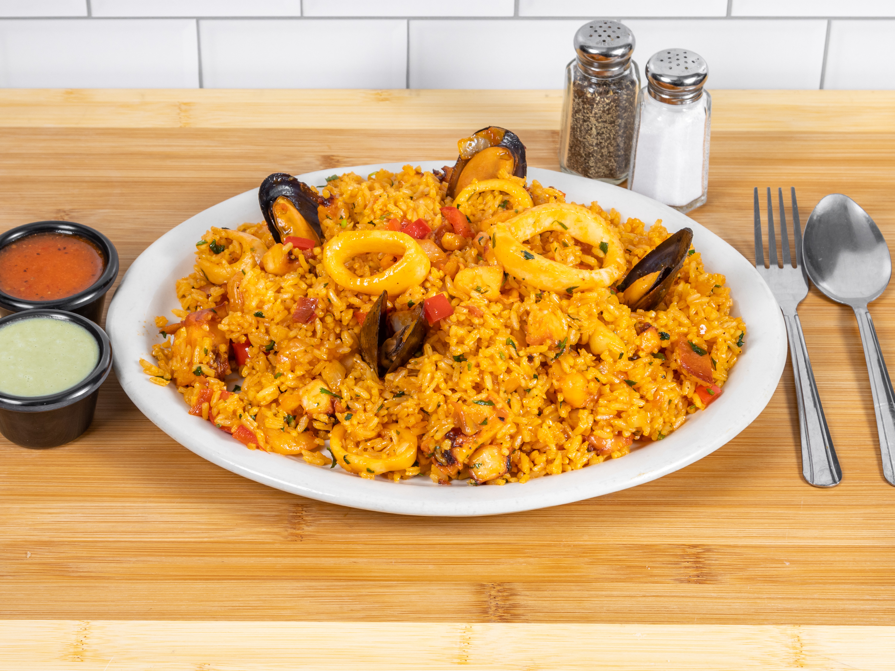 Order Arroz con Mariscos food online from Tineo Peruvian Cafe store, Richardson on bringmethat.com