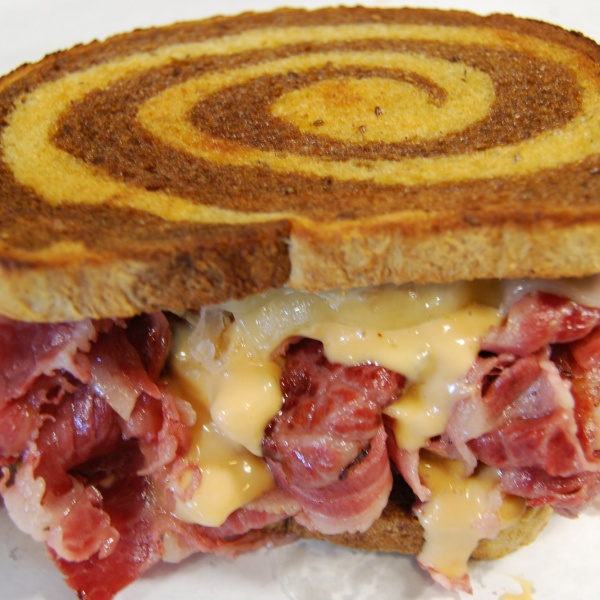 Order The Reuben Sandwich food online from Deli Zone store, Centennial on bringmethat.com