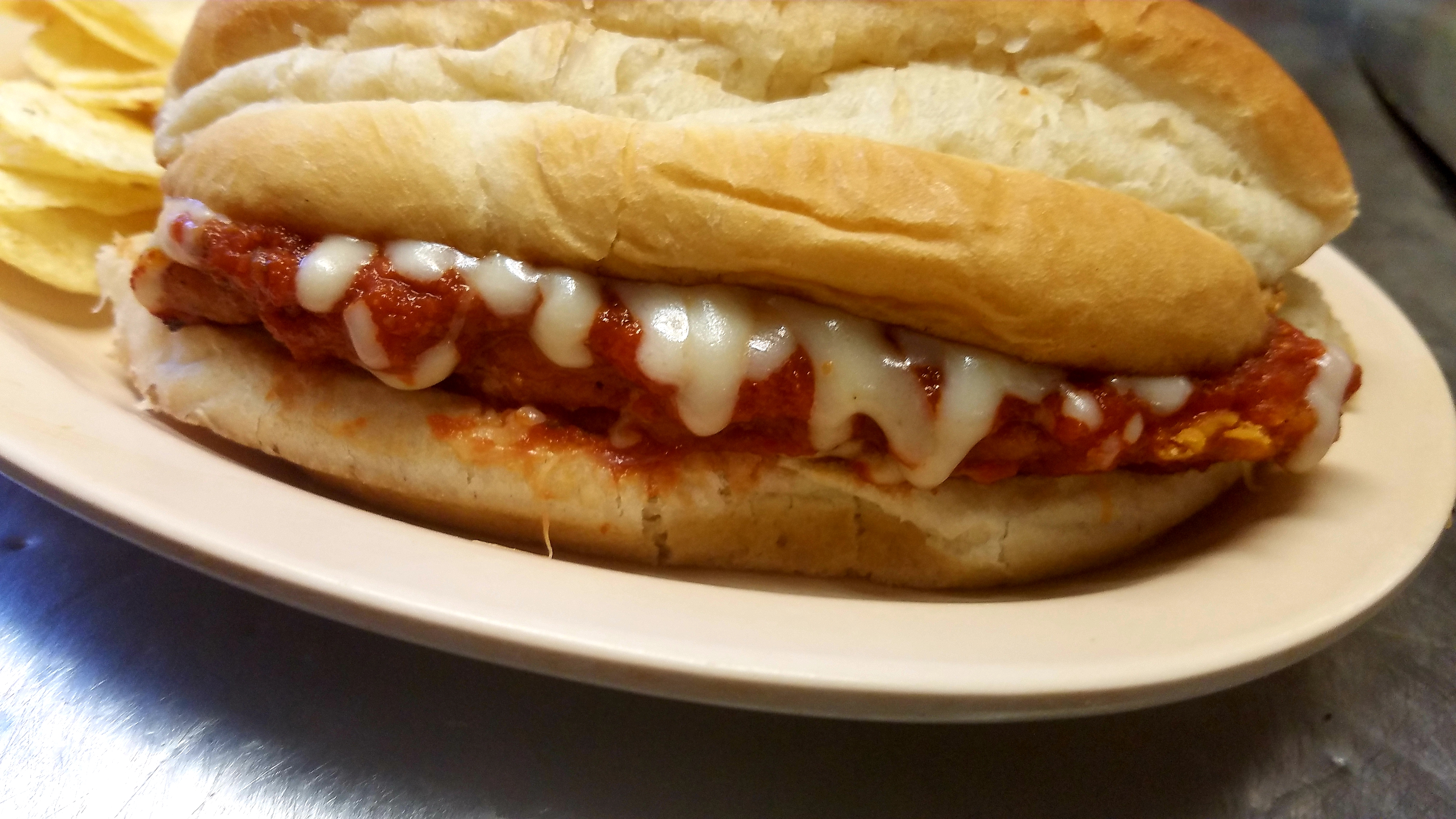 Order Chicken parmesan sandwich  food online from Coles Front Street Inn store, Greenville on bringmethat.com