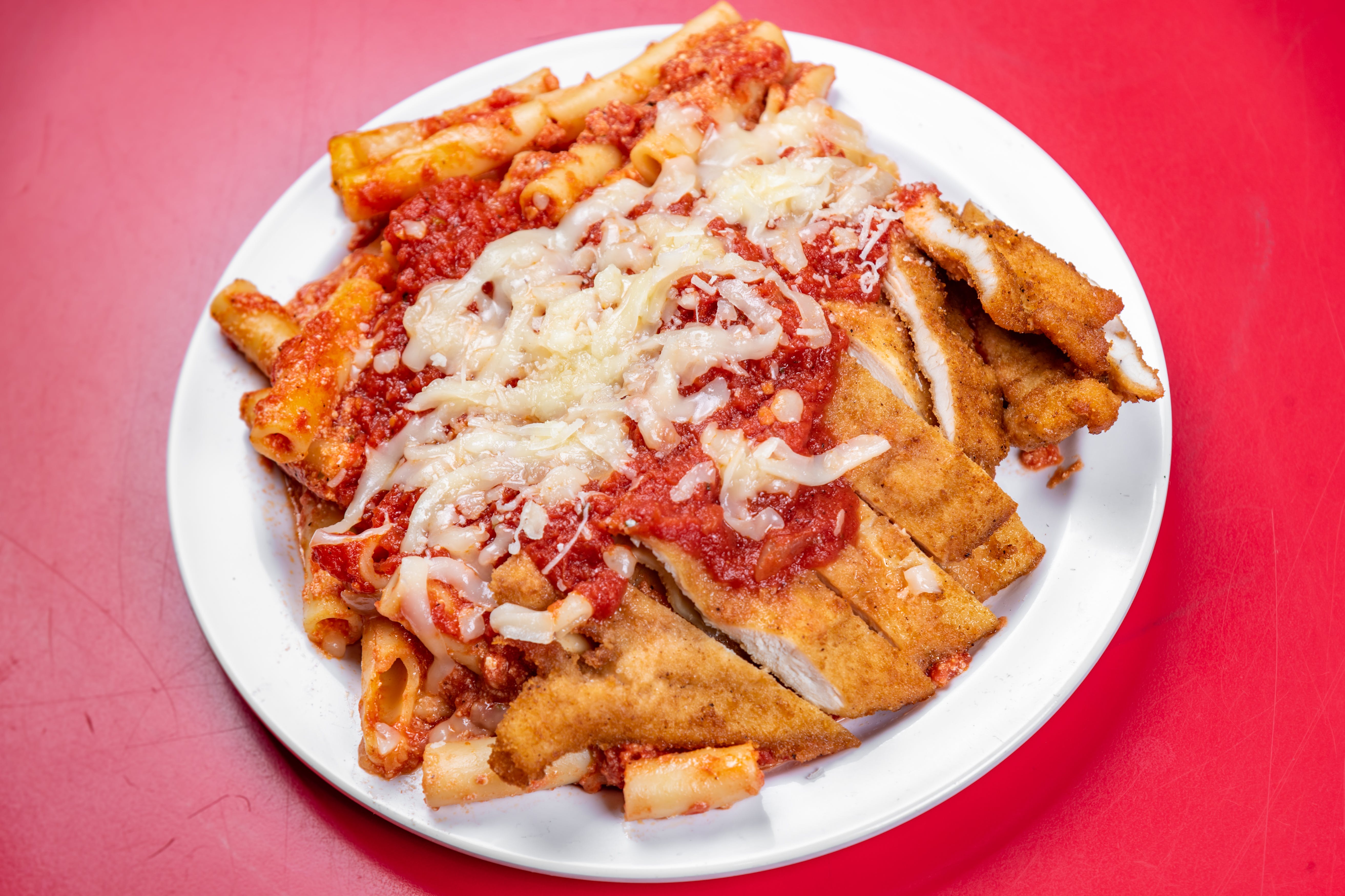 Order Chicken Cutlet Parmigiana - Entree food online from The Grotto Pizzeria store, New York on bringmethat.com
