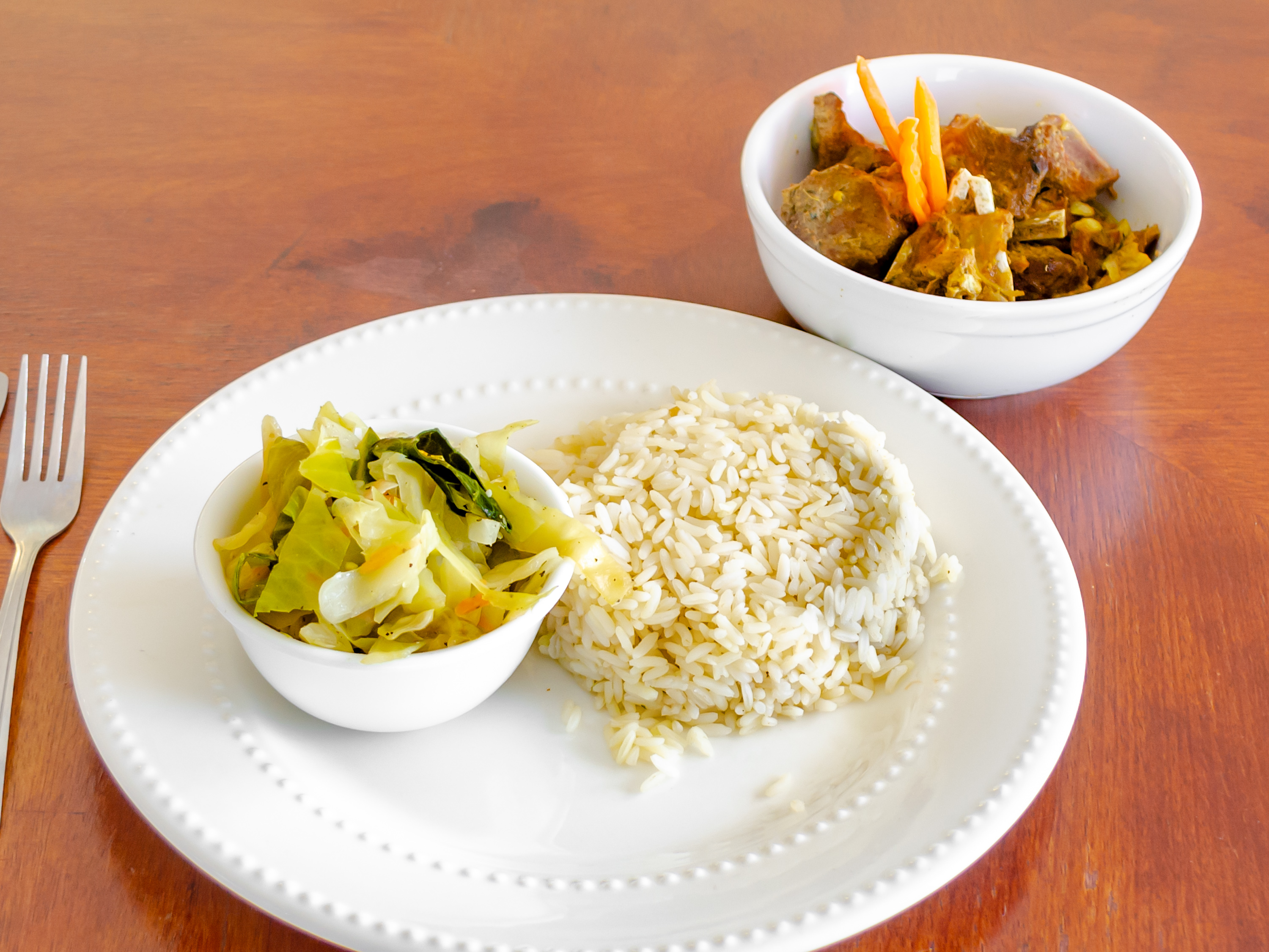 Order Curried Goat food online from Dainty Kitchen store, Colorado Springs on bringmethat.com