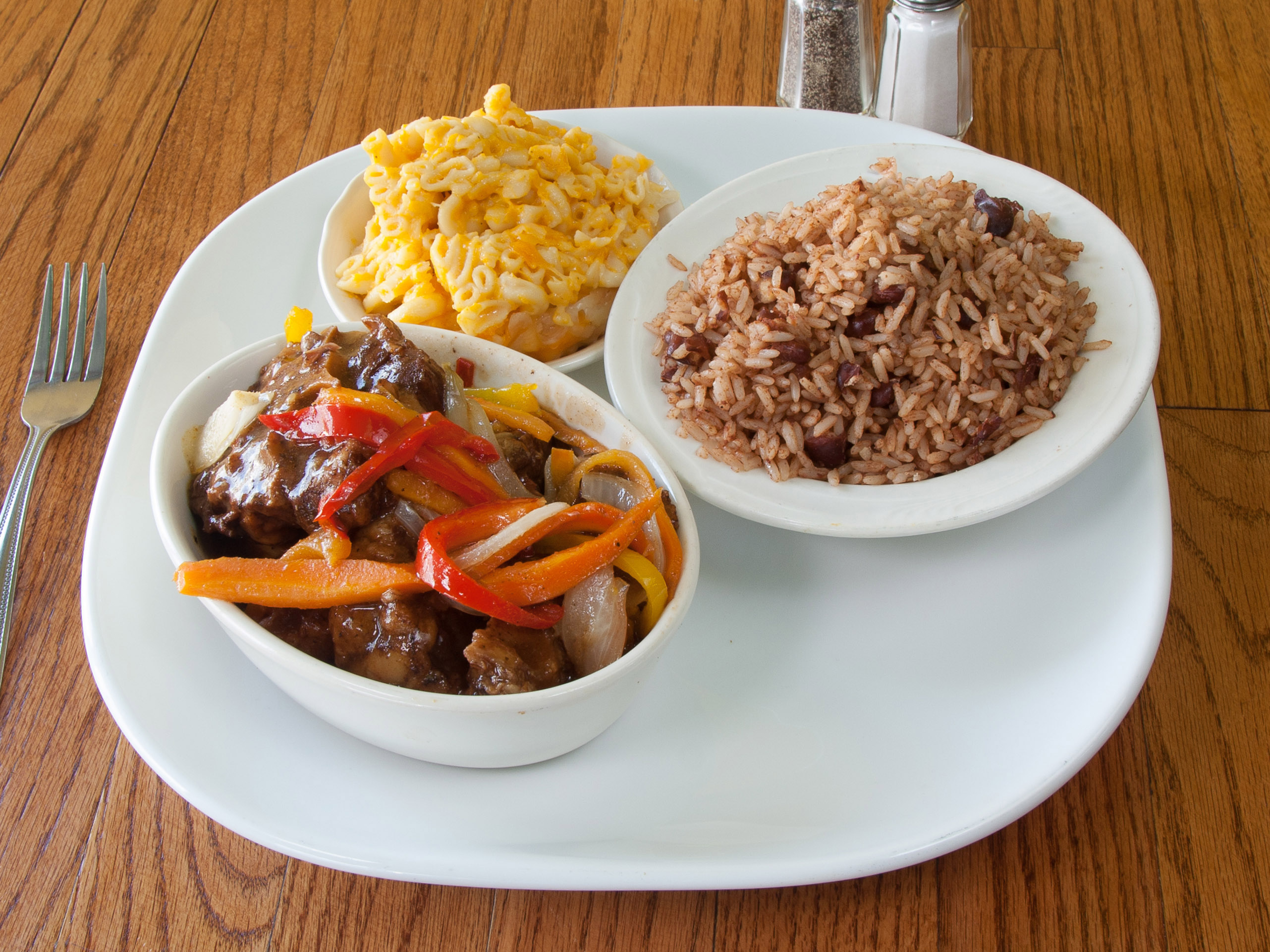 Order Oxtail Dinner food online from Jerk Flavors Restaurant And Lounge store, Markham on bringmethat.com