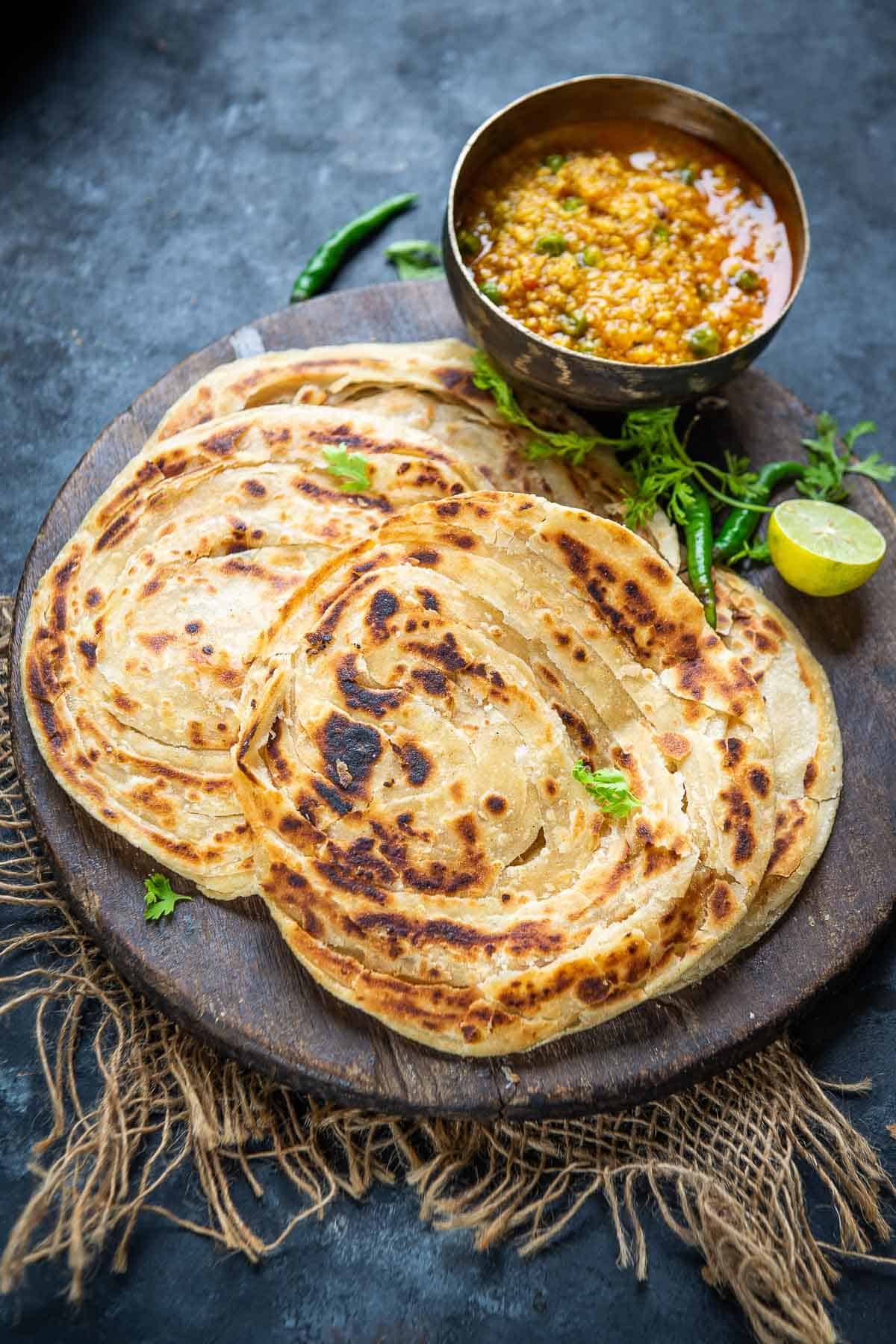 Order Lachcha Paratha food online from Himalayan flavors store, Berkeley on bringmethat.com