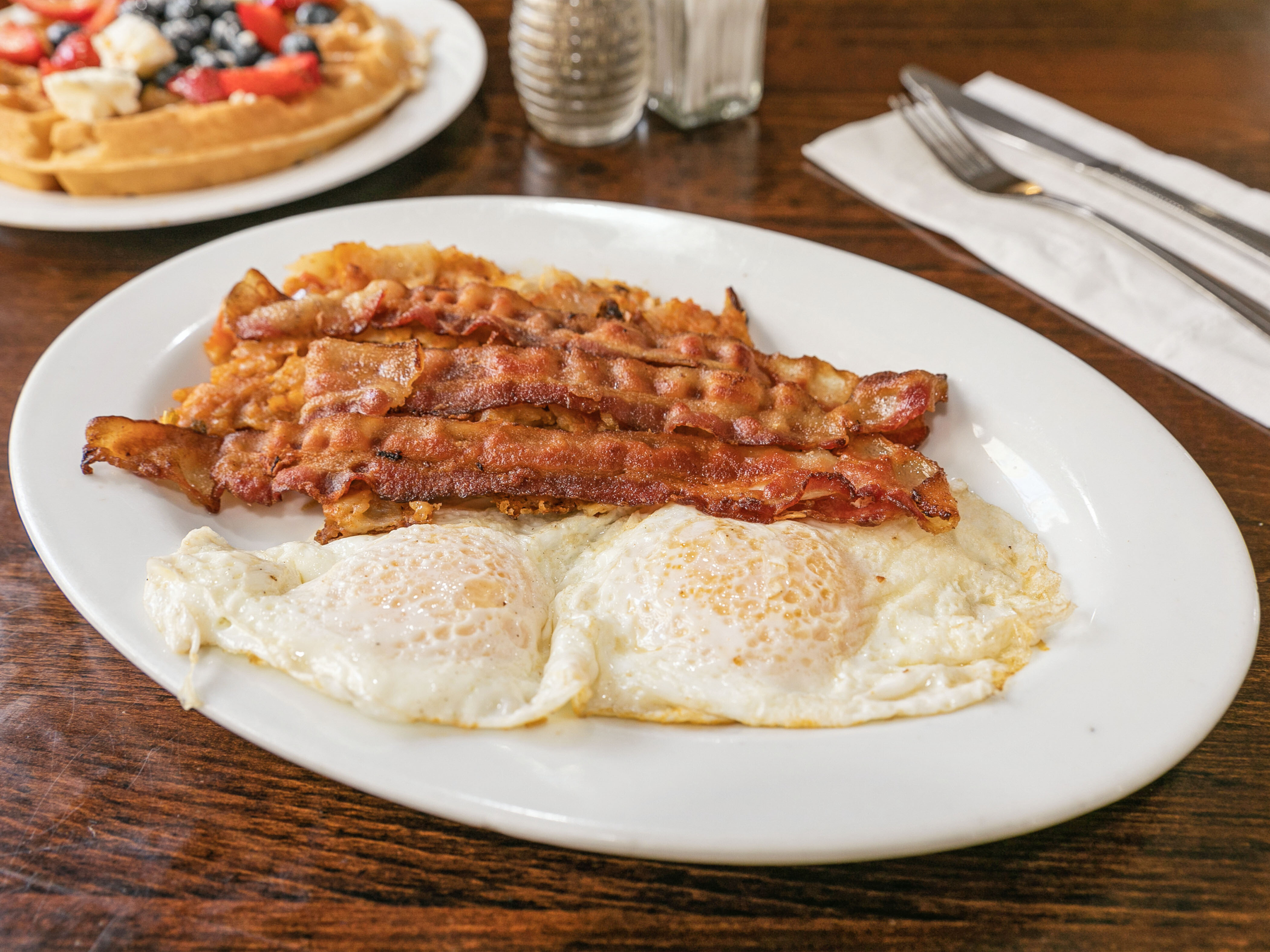 Order Two  Large Eggs with Bacon food online from Eat here now store, New York on bringmethat.com